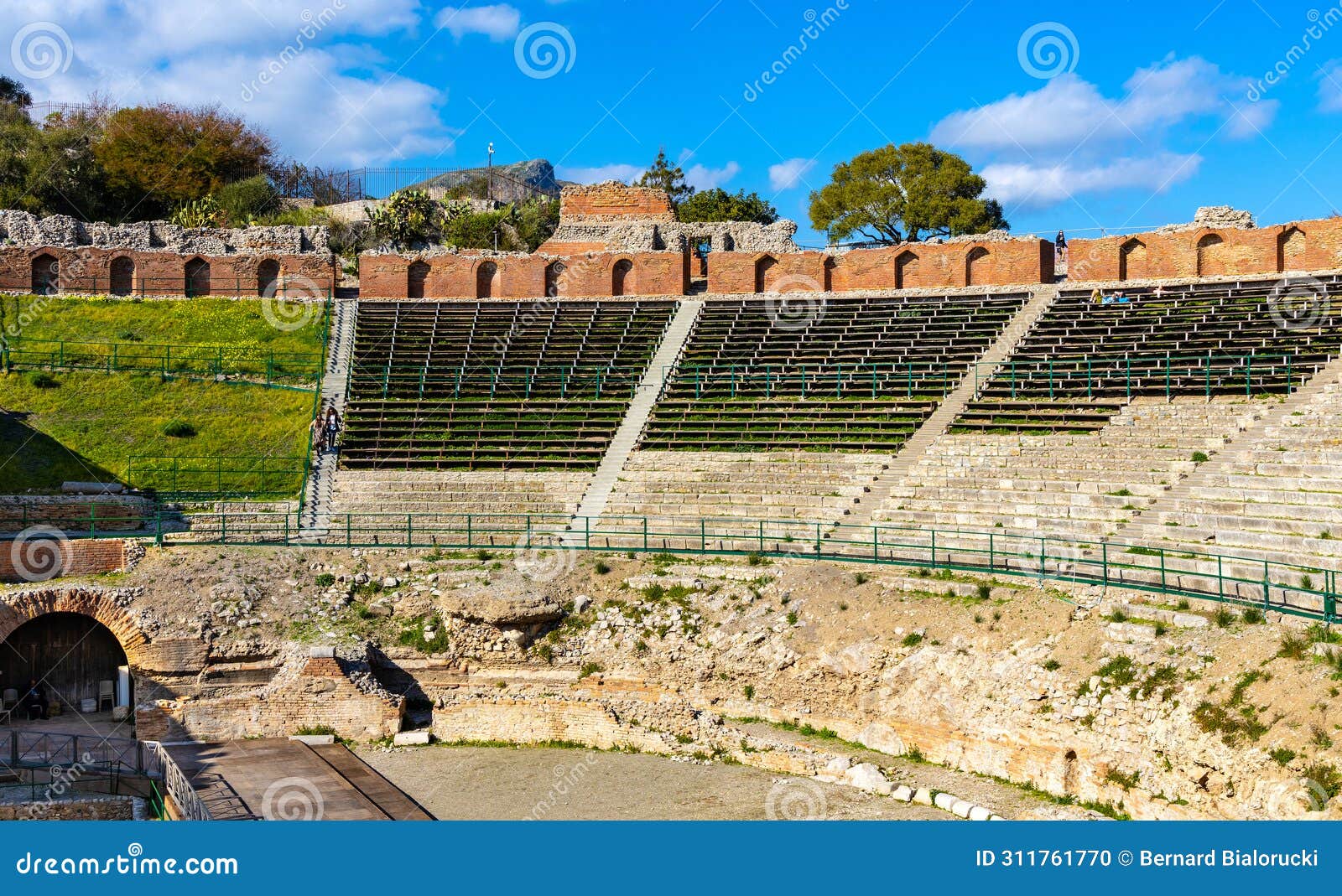 greek and roman teatro antico ancient theatre with cavea seating auditorium in taormina at ioanian sea shore of sicily in italy