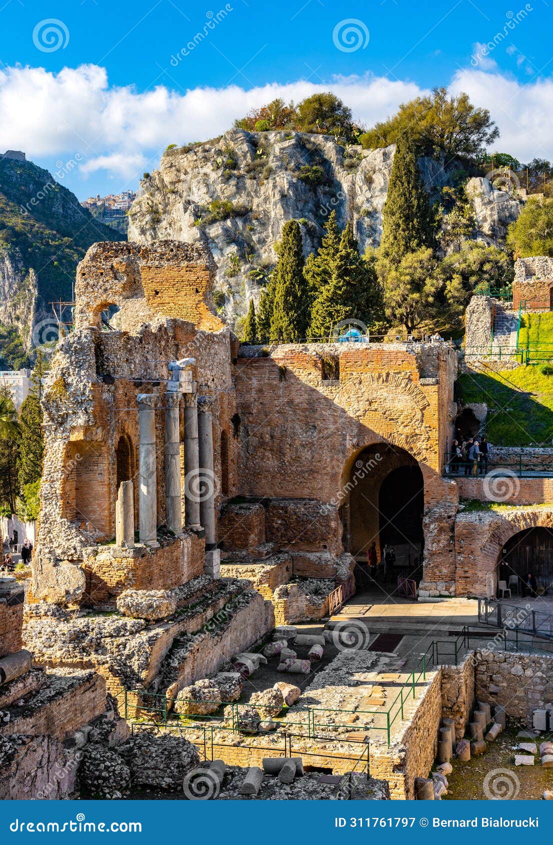 greek teatro antico ancient theatre with stage and arches colonnade in taormina at ioanian sea shore of sicily in italy