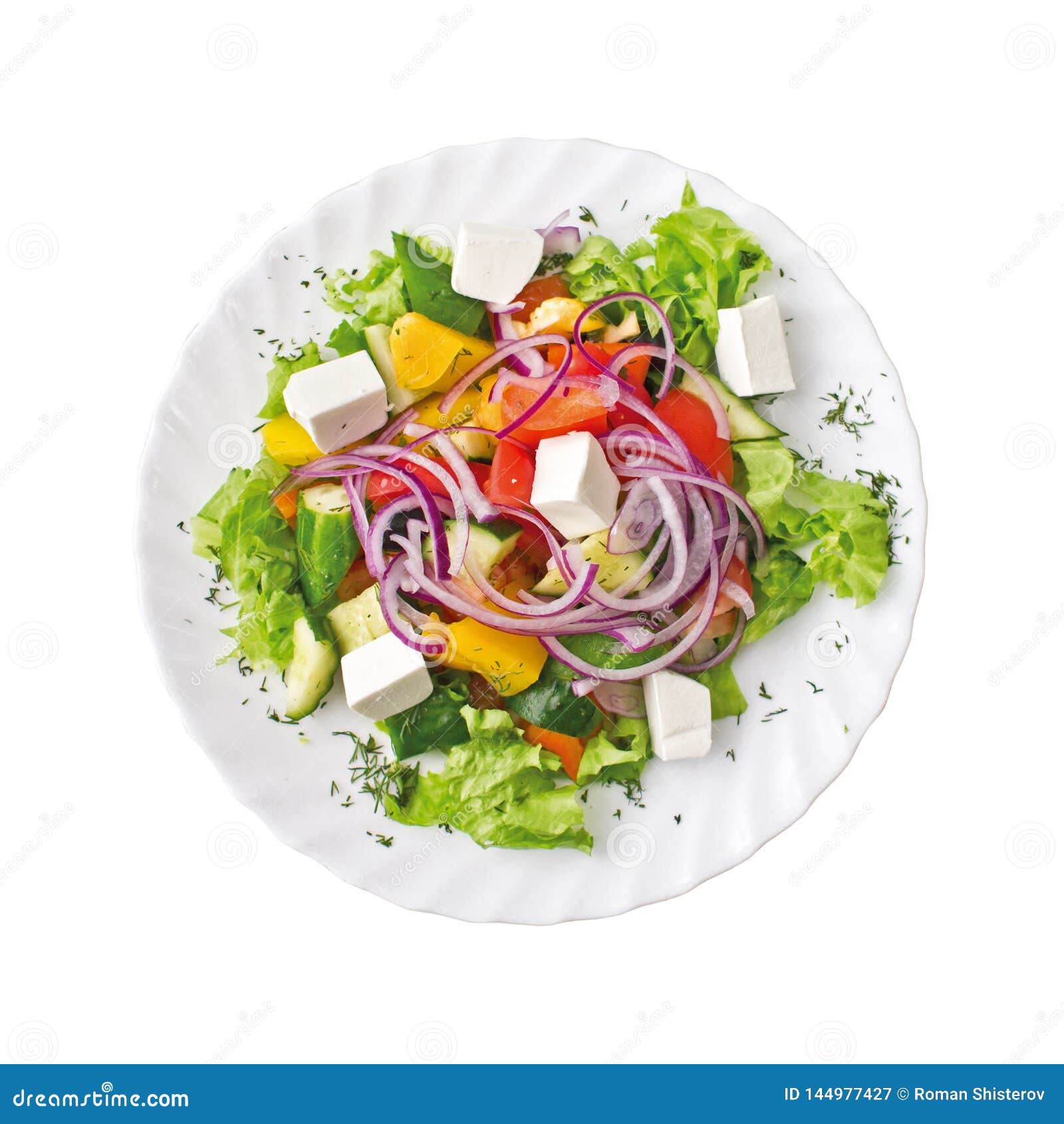 greek salad on a plate,  on white background. top view.