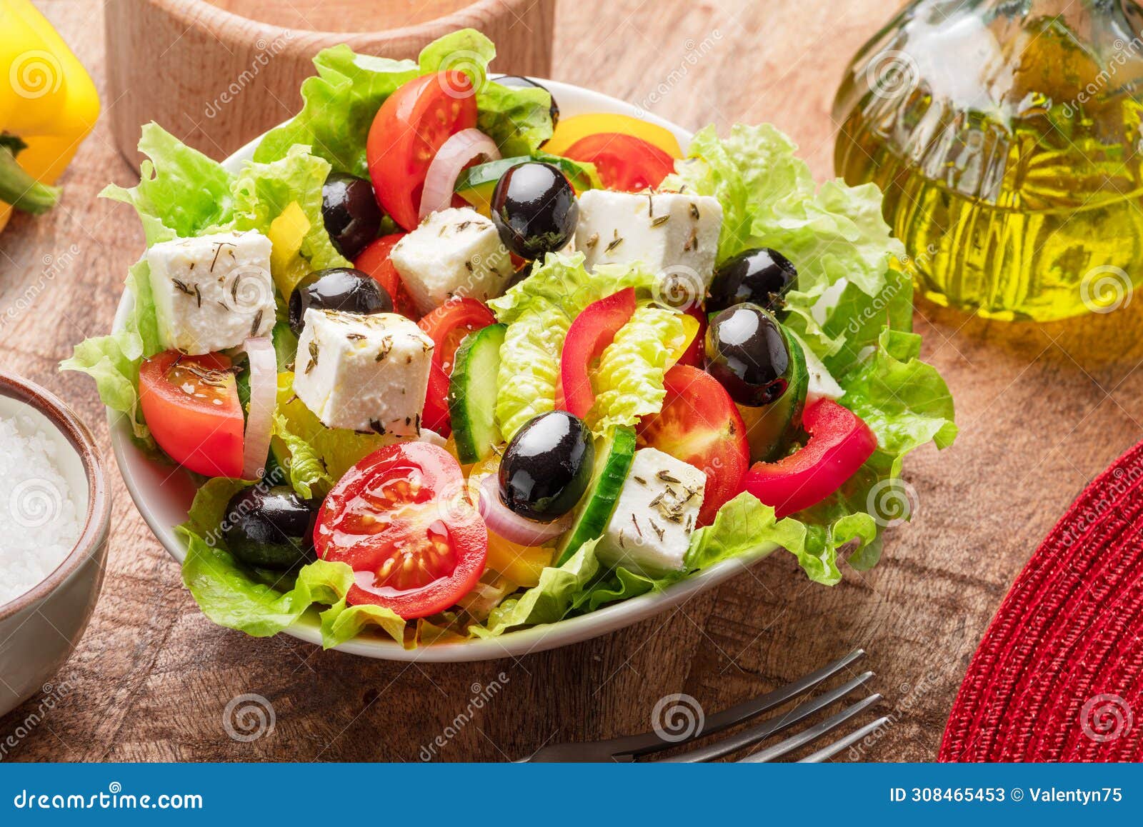 greek salad on wooden table served and ready to eat