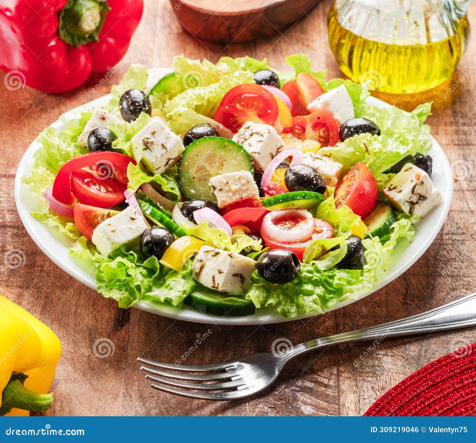 greek salad on wooden table served and ready to eat