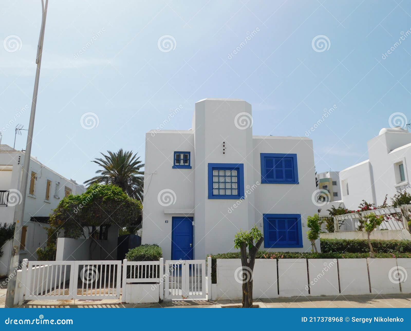 greek style house in blue and white on cyprus island.