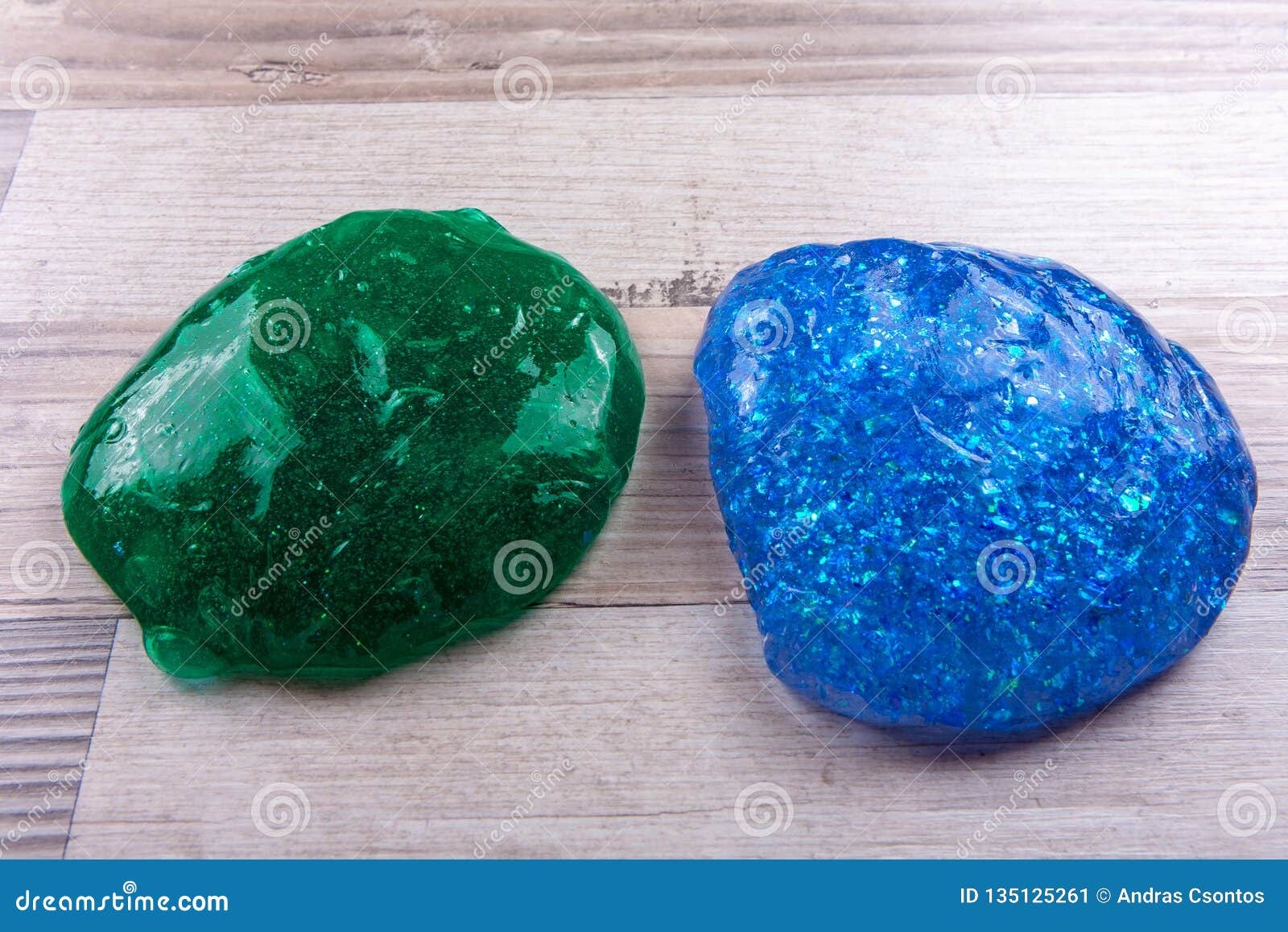 green adn blue slime on a wooeden table