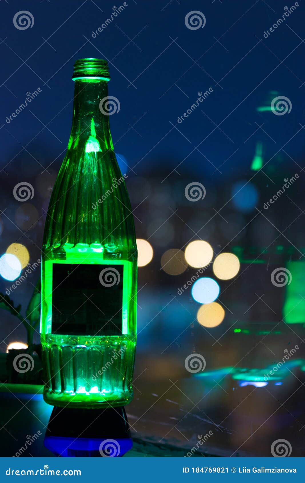 Green alcohol bottle stock image. Image of light, addiction 184769821