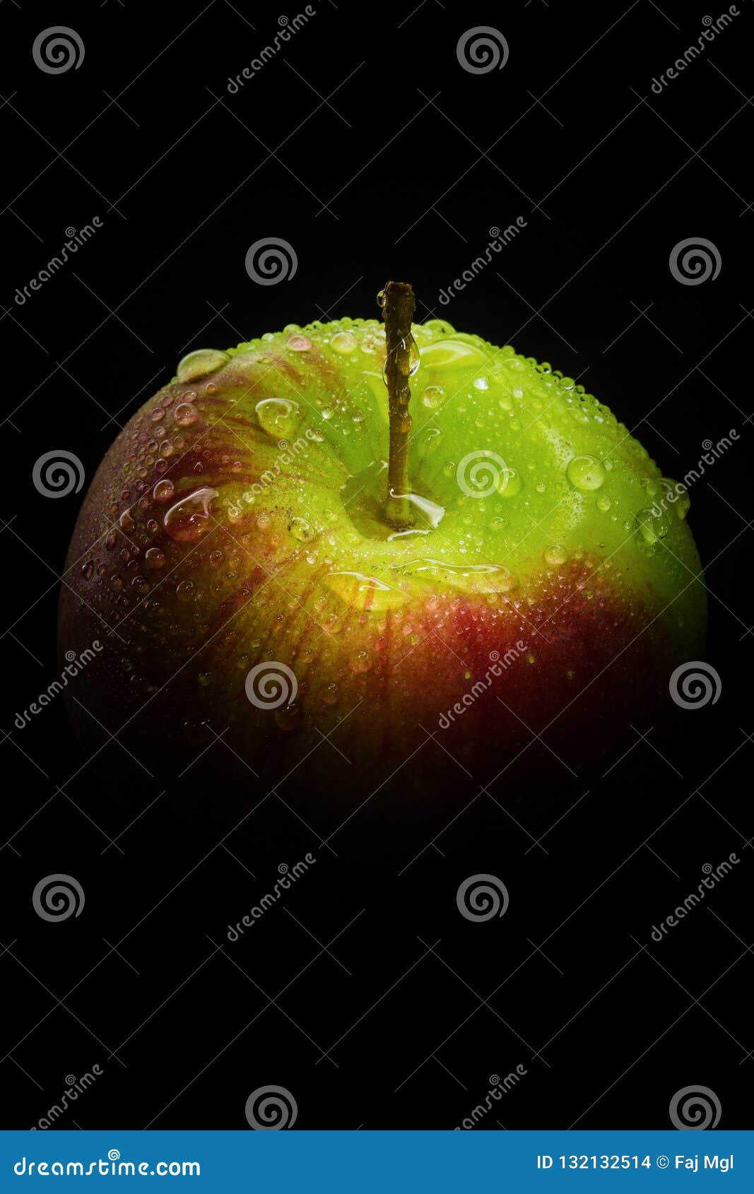 green apple in black isolation