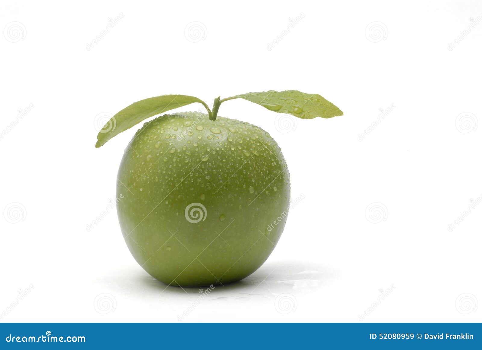 One Fresh Green Apple with Leaves and Water Drops Close Up Isolated on