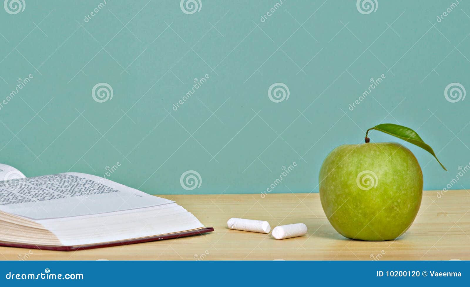 Green apple and open book stock photo. Image of food - 10200120