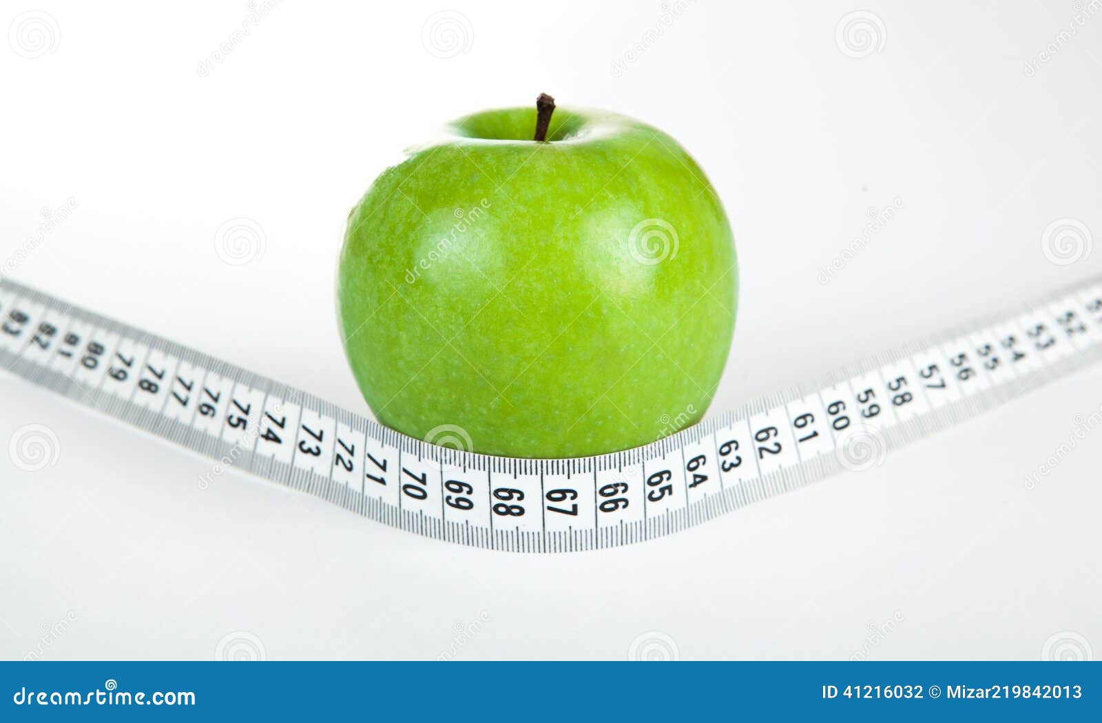Green apple with a ruler stock photo. Image of centimeter 41216032