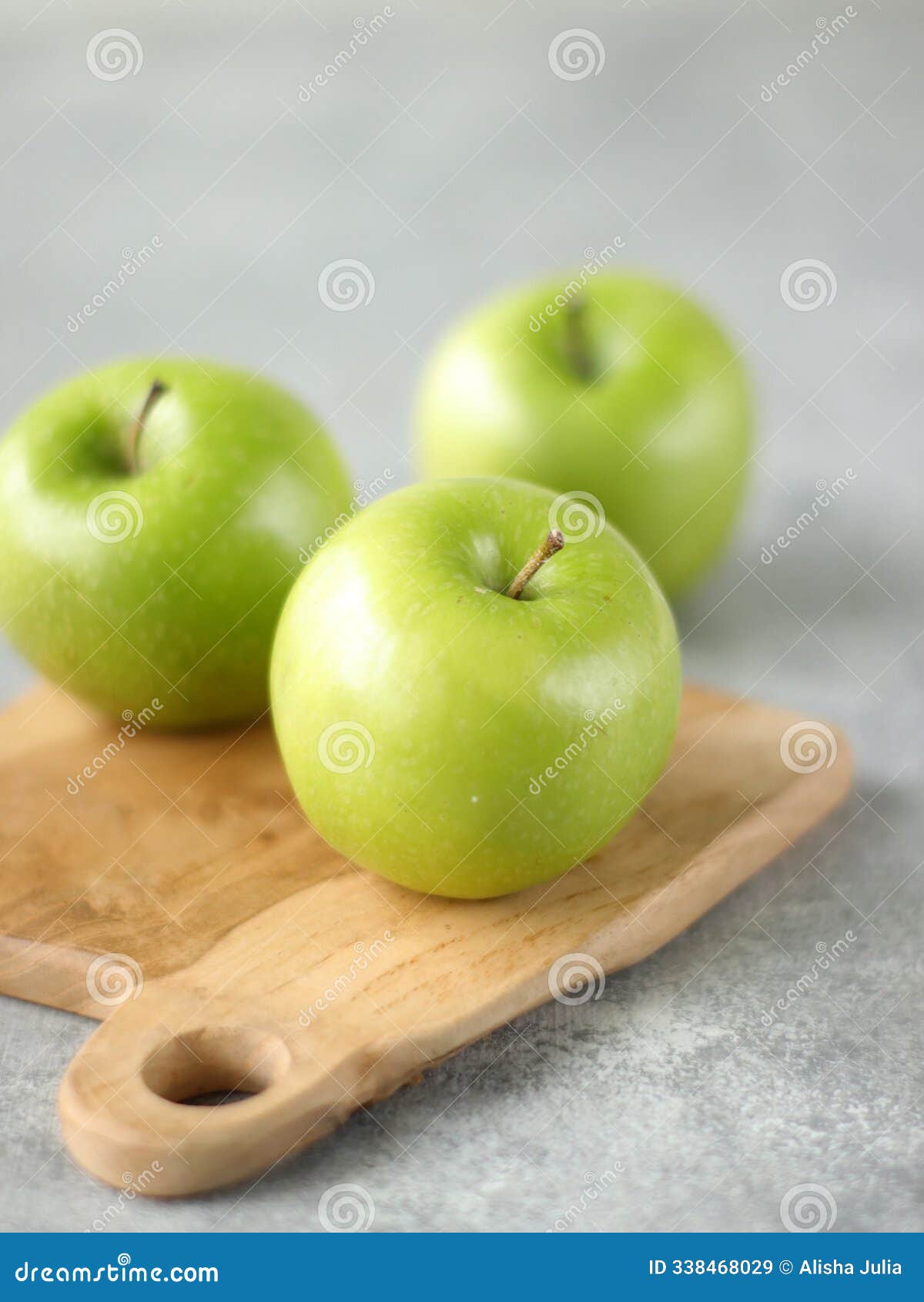 green apples grany smith on a wooden tray