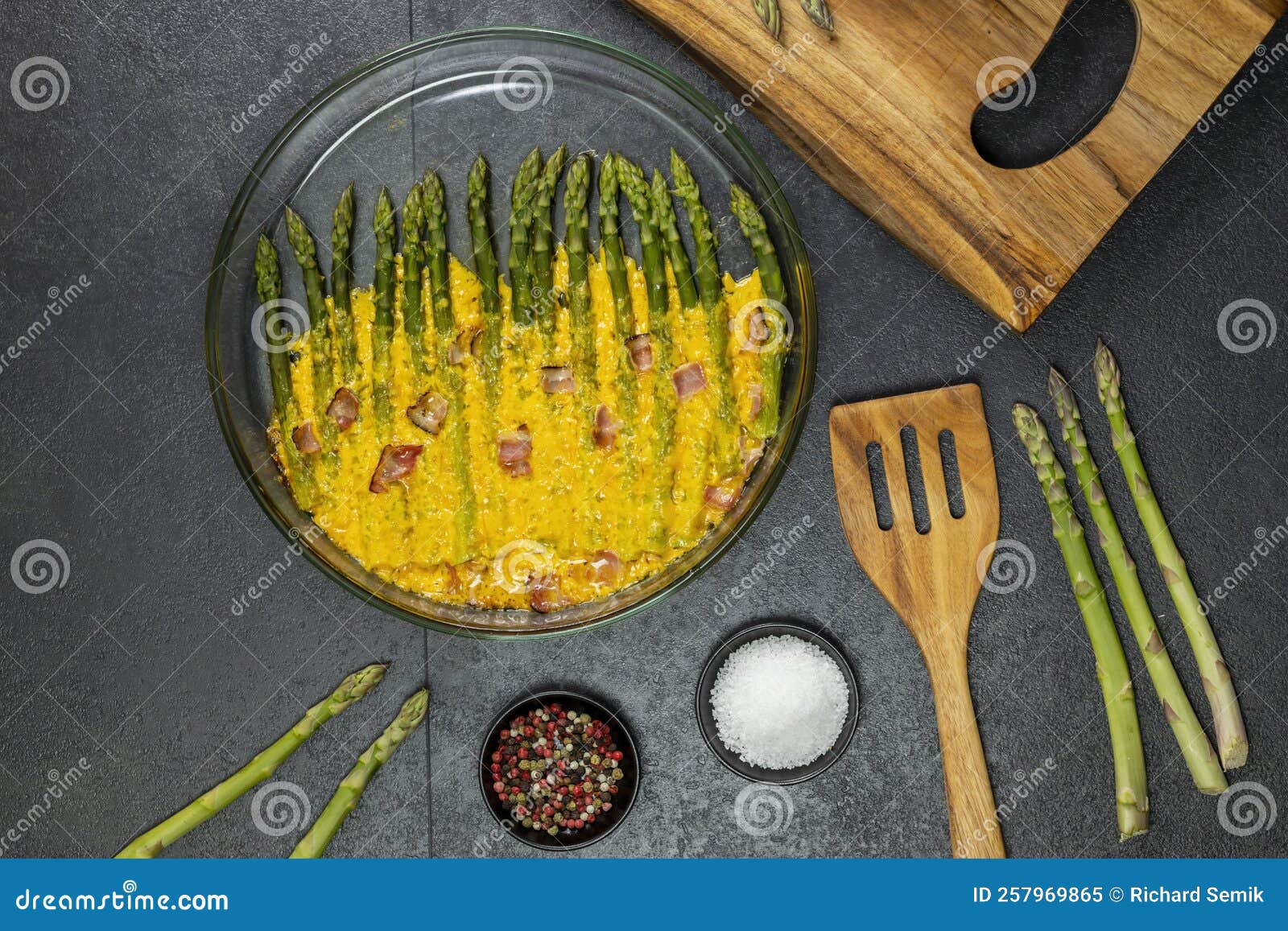 Green Asparagus Baked with Chedar Cheese and Parma Ham Stock Image