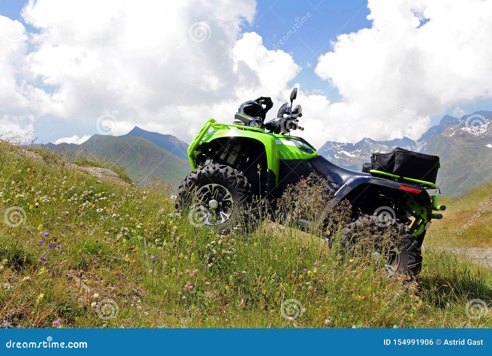 A Green ATV Stands on a Steep Mountain Path. Stock Photo Image of