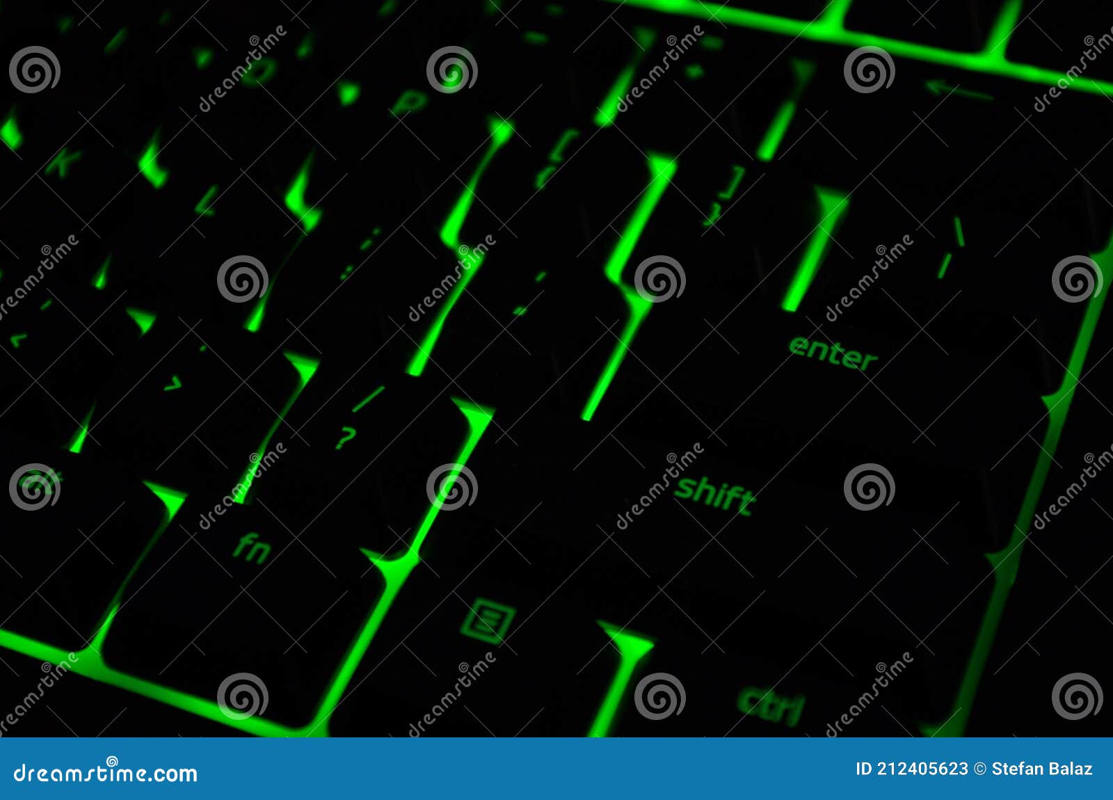 green backlight, backlit on keyborad computer of gaming in the dark. paused game. cyber attack, internet security concept.