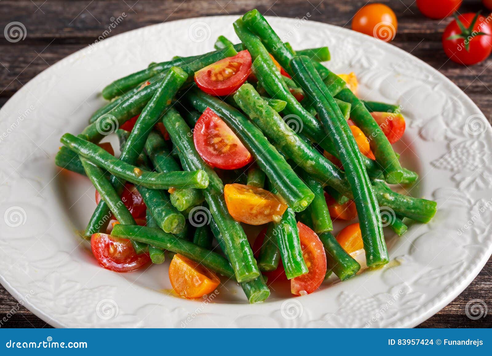 Green Beans Salad with Red, Yellow Tomatoes on White Plate Stock Photo