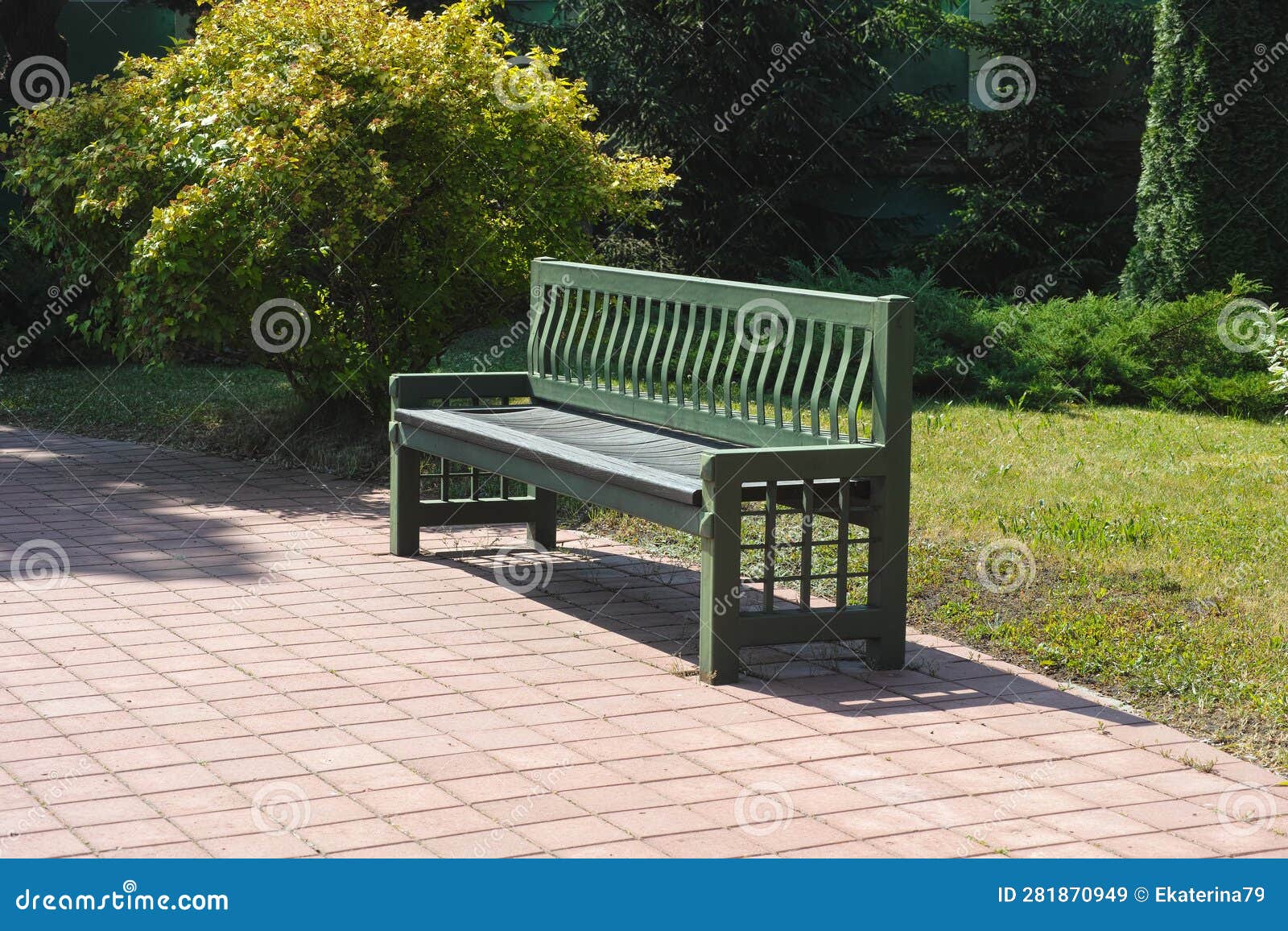 Green Bench Standing in a Park with Green Plants Stock Image Image of