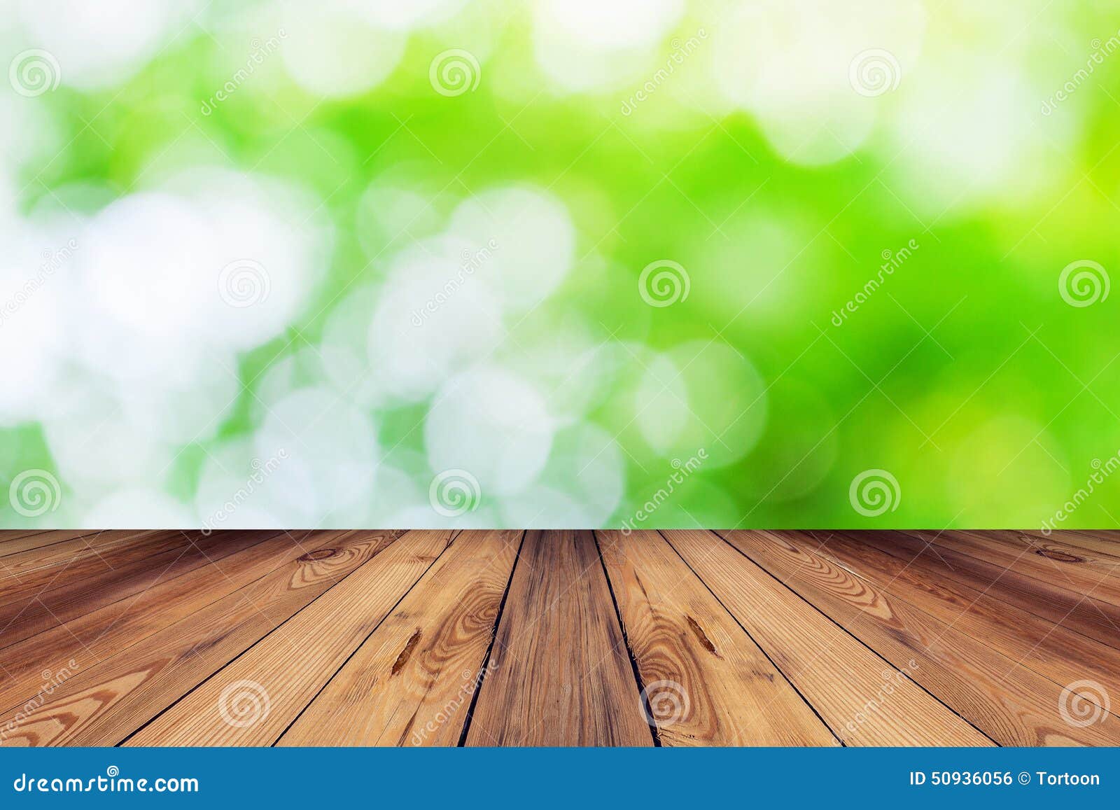 Green Bokeh Blur Background And Wood Table In Garden Stock Photo