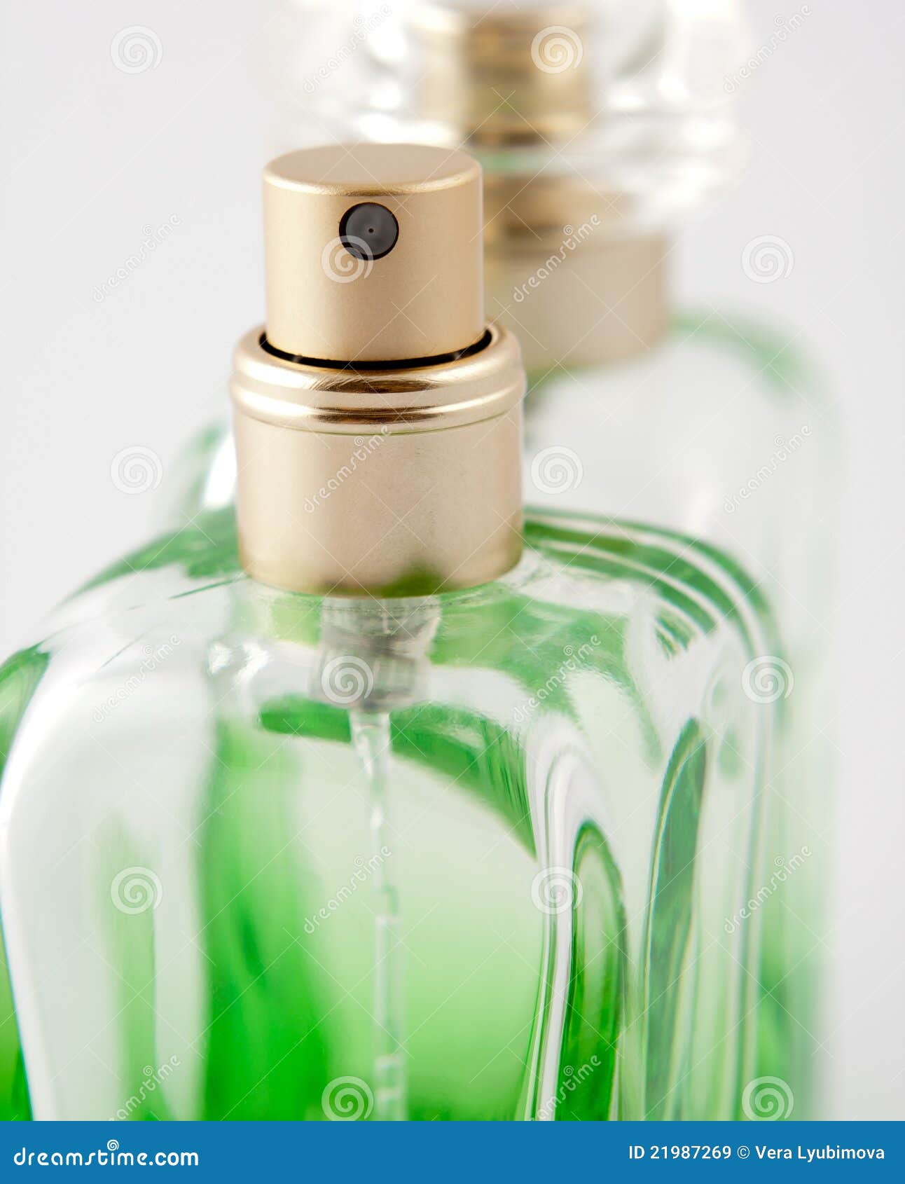 Green bottle of perfume stock image. Image of glamour 21987269
