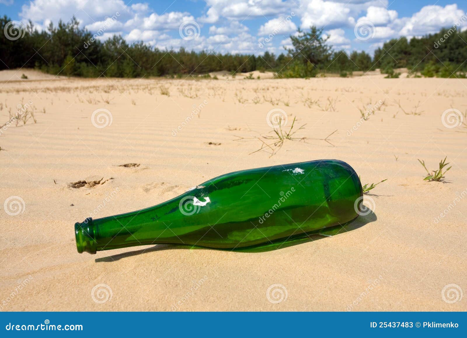 Green bottle in sands stock image. Image of closeup, island 25437483