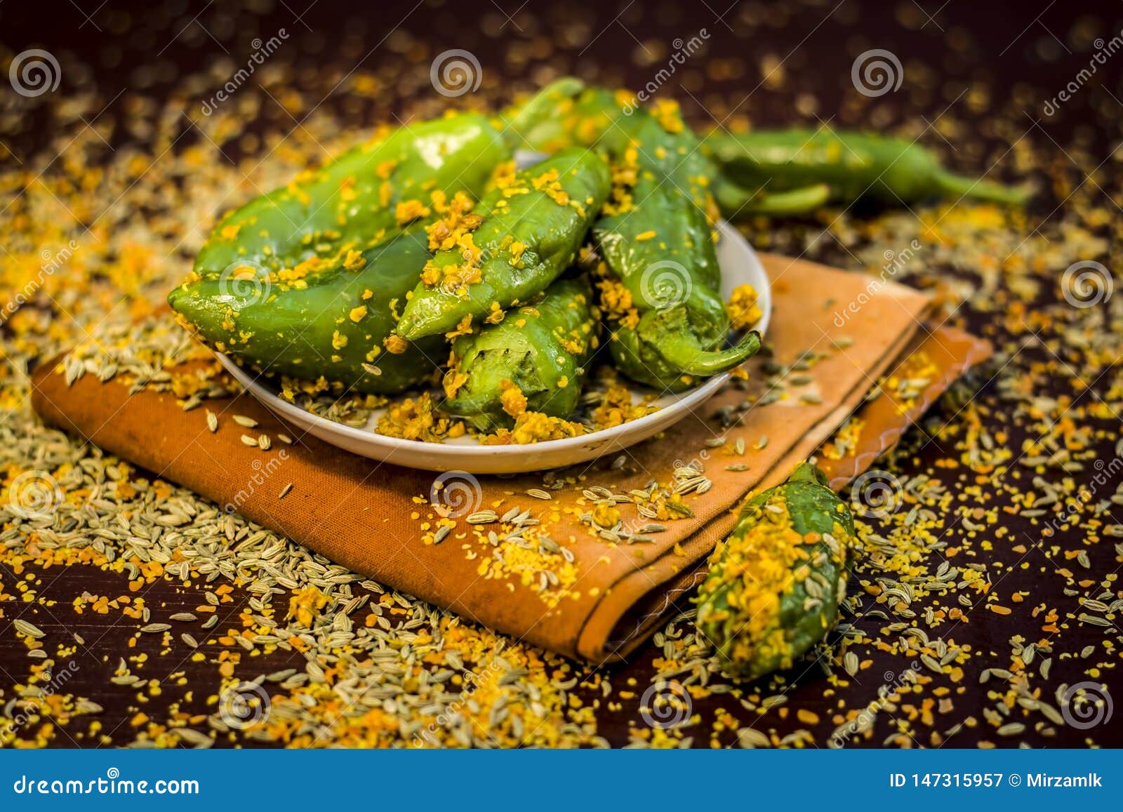 green chilli pickle marinated in mustard seeds and mustard oil. dark gothic style still life concept
