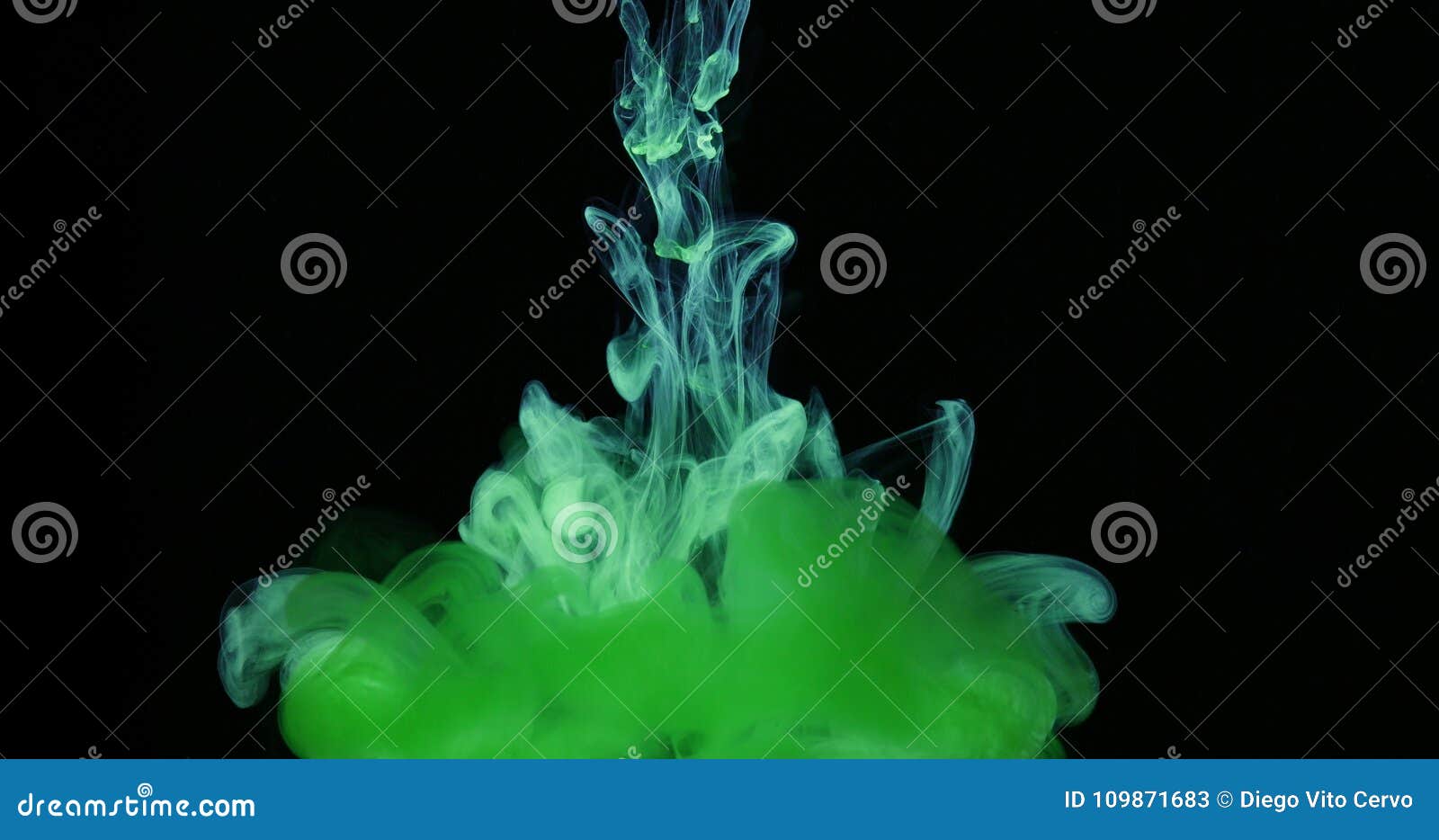 green ink colors in water creating liquid art s