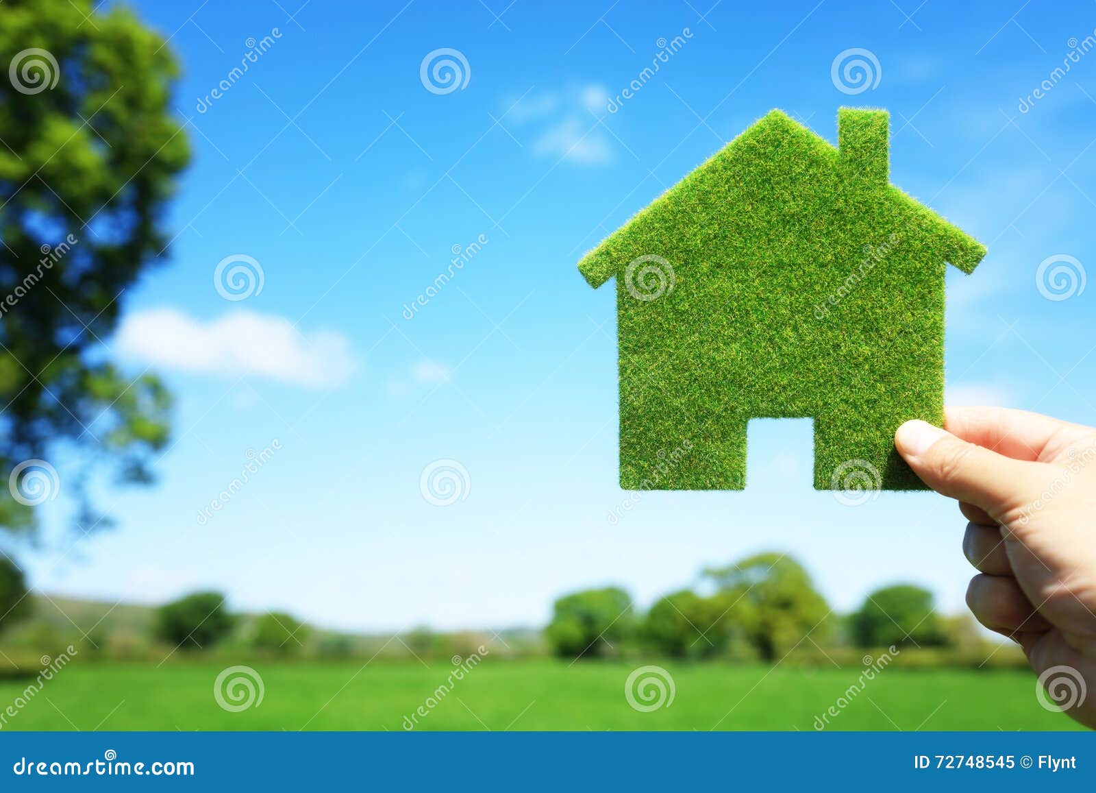 green ecological house in empty field