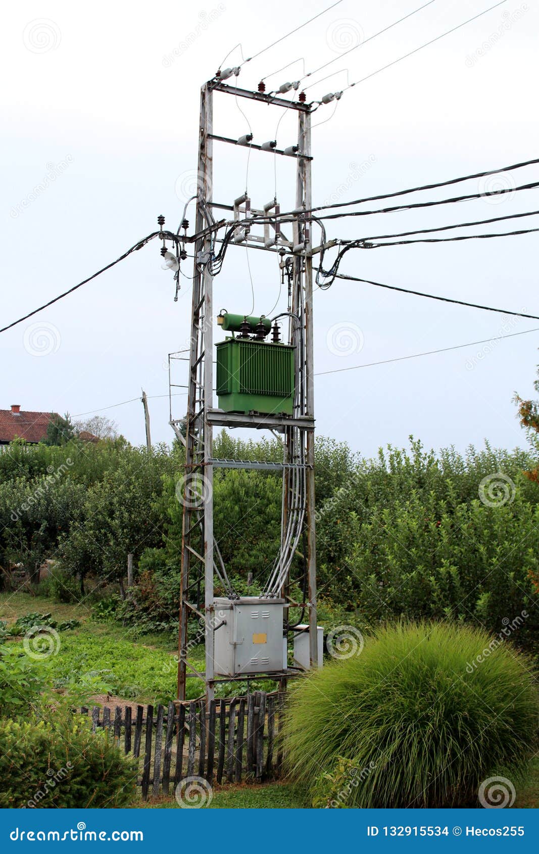 Green Electric Power Transformer with Metal Utility Box on High