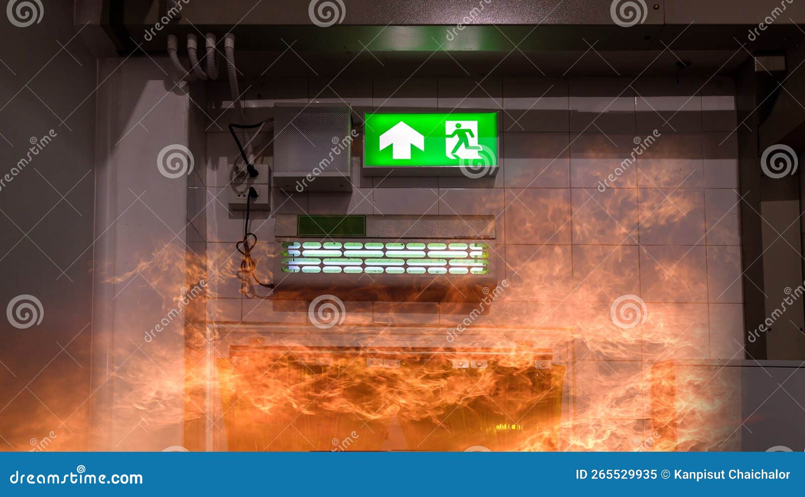 Green Emergency Exit Sign Showing the Way To Escape. Fire Exit in the