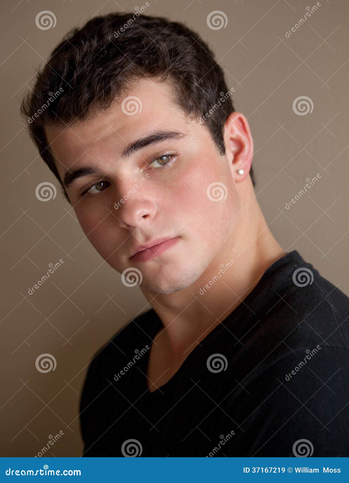 Green Eyed Teenage Boy stock image. Image of face, earring - 37167219
