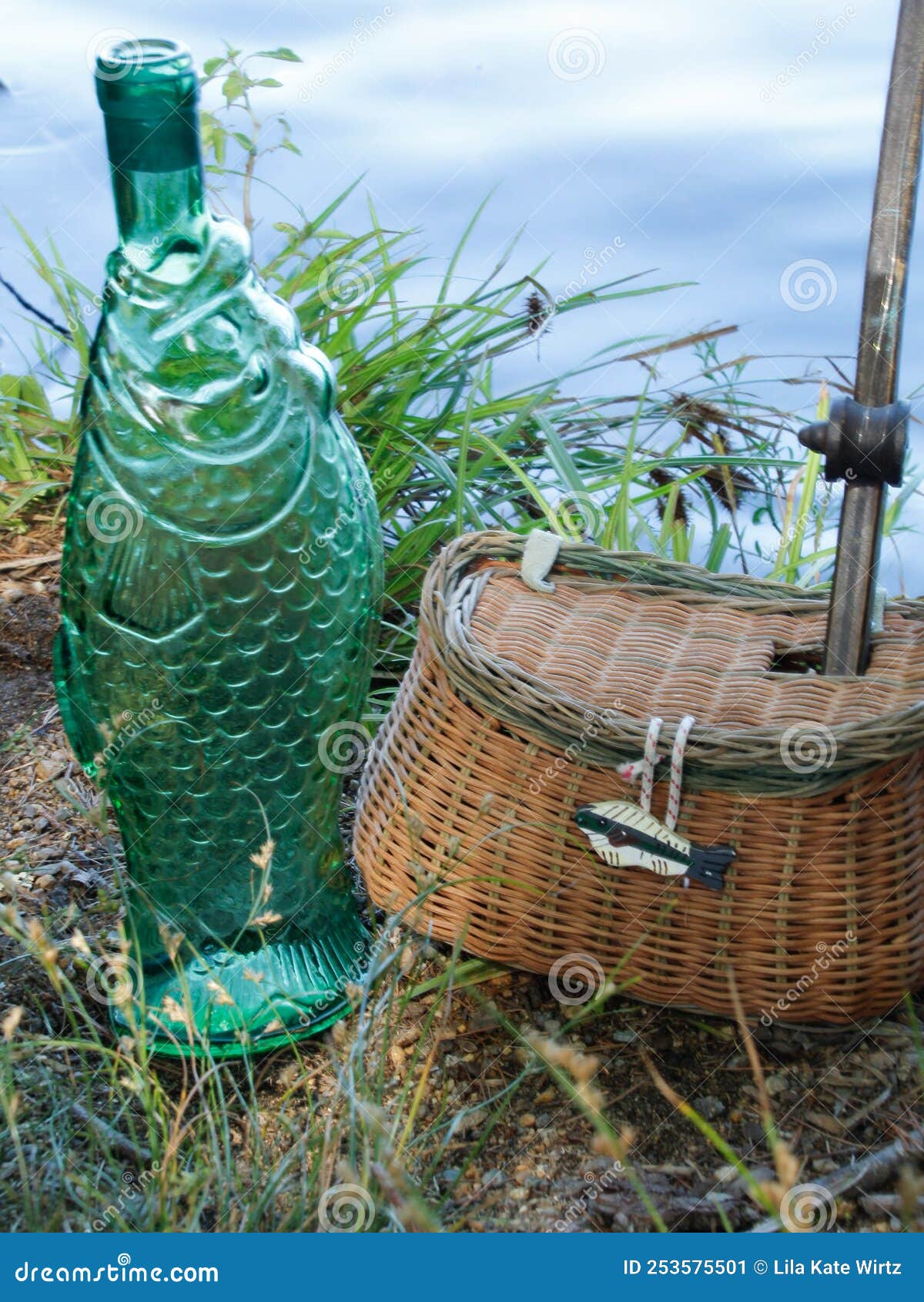 Green Fish Bottle, Small Wicker Fishing Basket with Hole for Small Wooden  Fishing Pole with Hook on the End Stock Image - Image of access, lures:  253575501