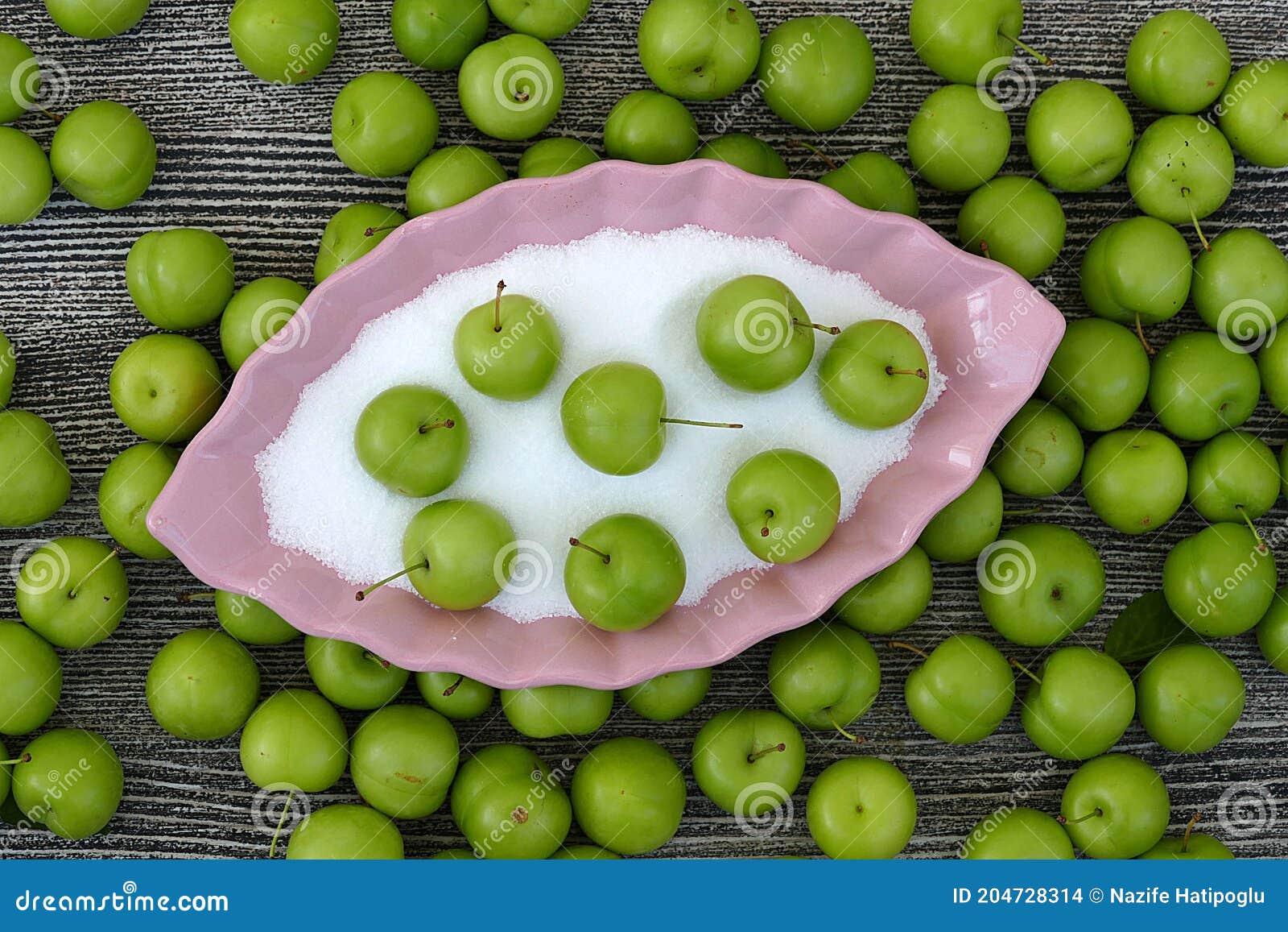 Green Fresh Sour Plums and Salt in the Dish, Sour Plums with Salt Stock