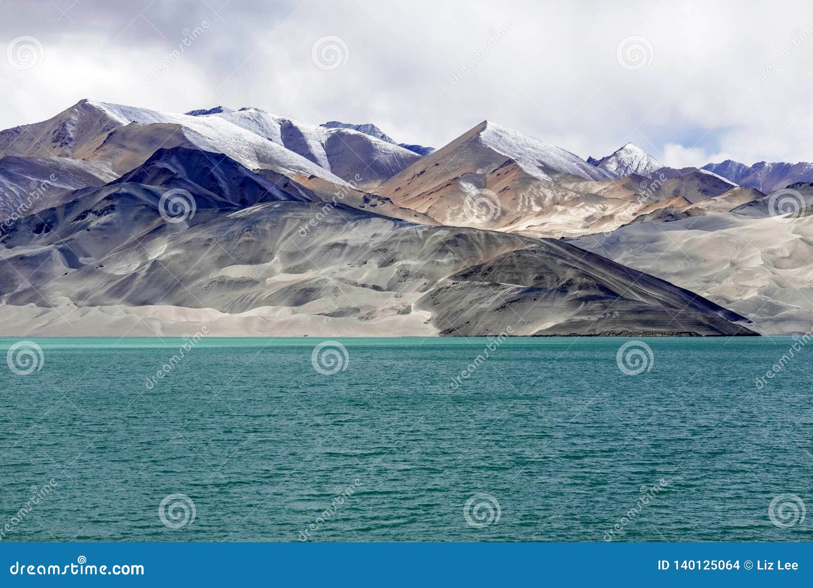 green lake, snow mountain, white clouds, blue sky