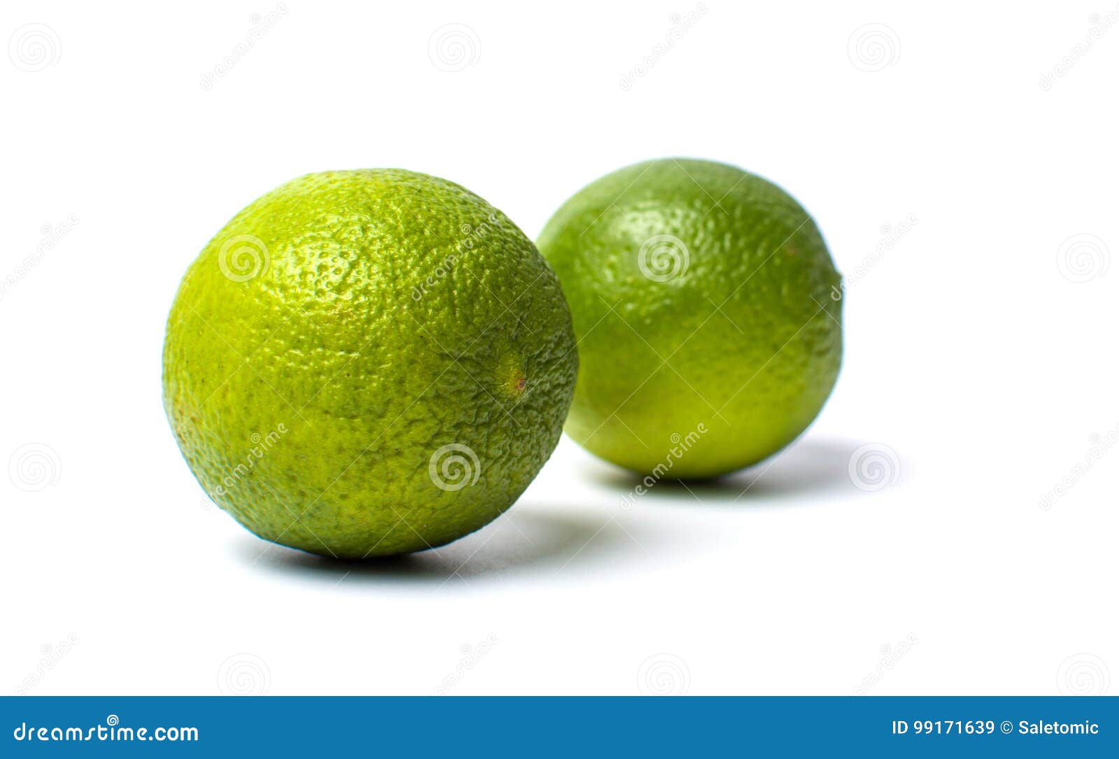 Green lime fruit on white stock image. Image of slice 99171639