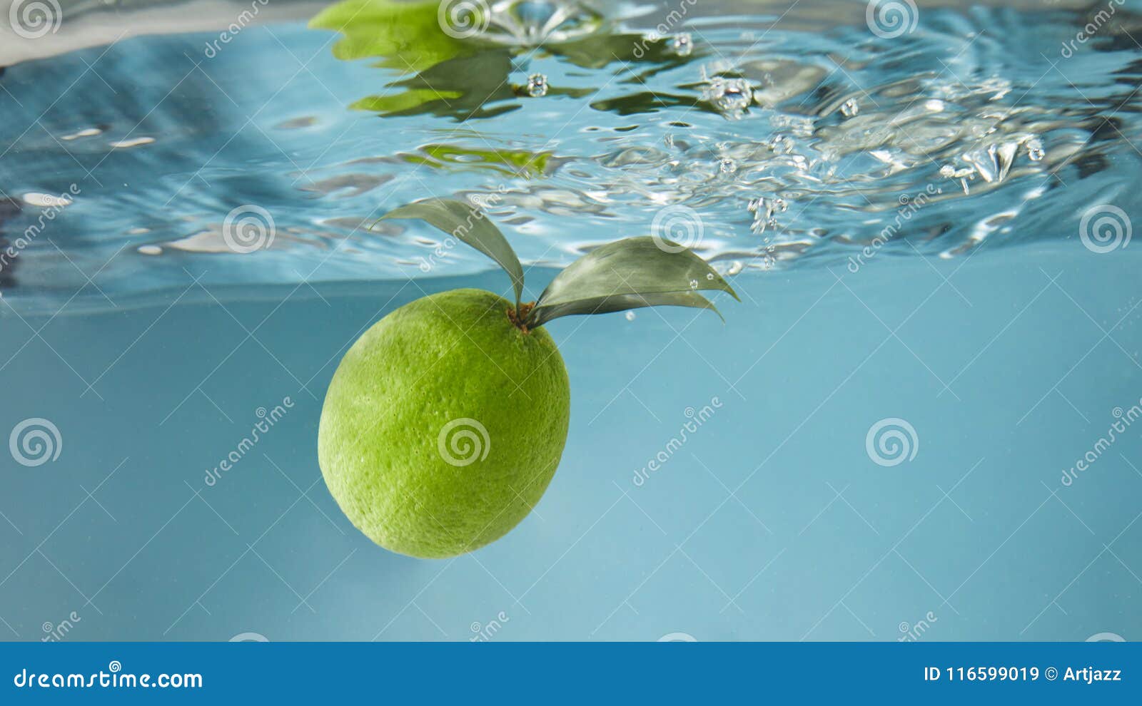 Green Lime Under Water with a Trail of Transparent Bubbles. Stock Image ...