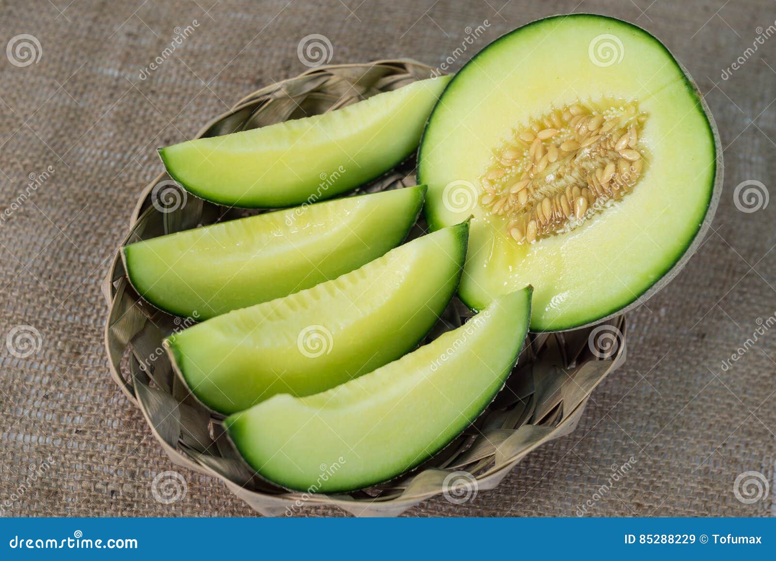 Green melon in basket stock image. Image of single, green 85288229