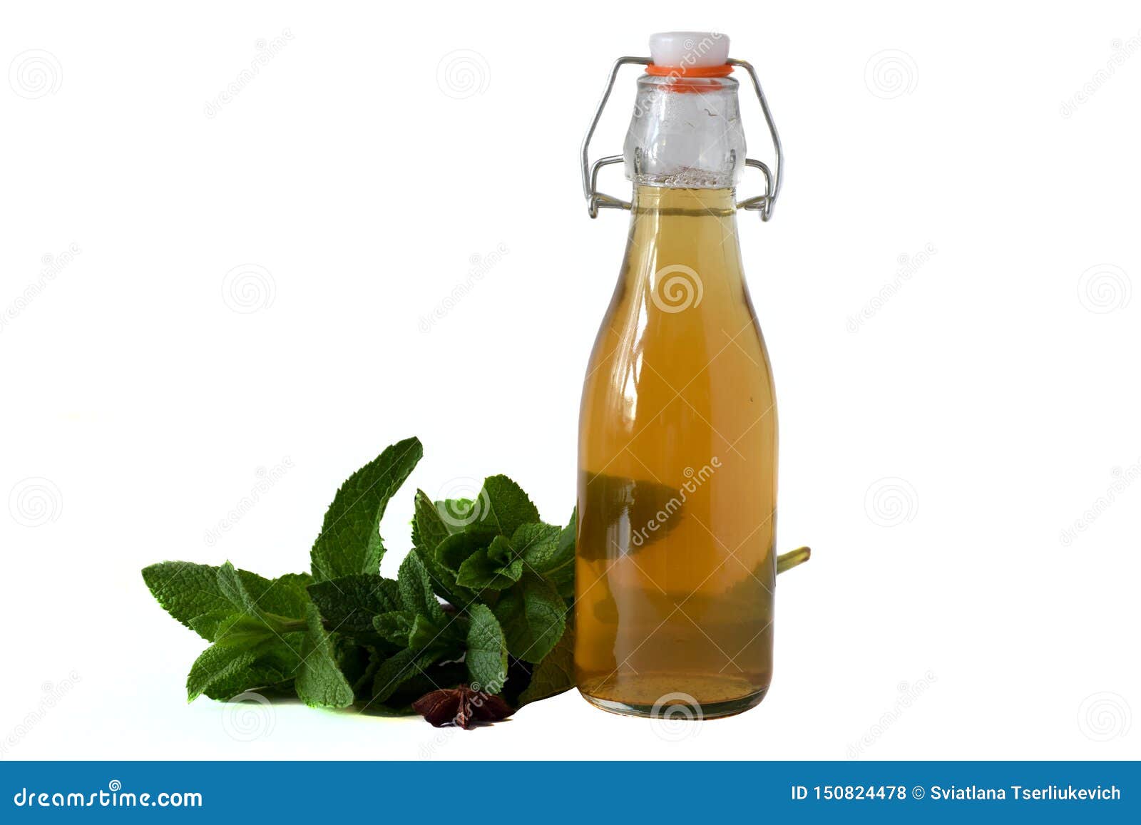 Green Mint Tea In Bottle On Table With Mint Sprigs Isolated On White