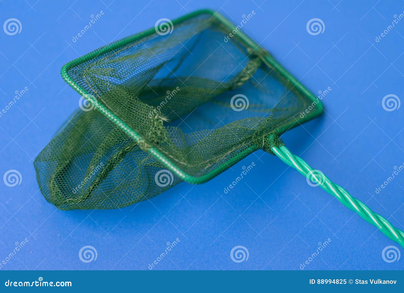 Green Net for Catching Fish from the Aquarium, Blue Background, Mesh with a  Small Cell Stock Image - Image of gear, catcher: 88994825