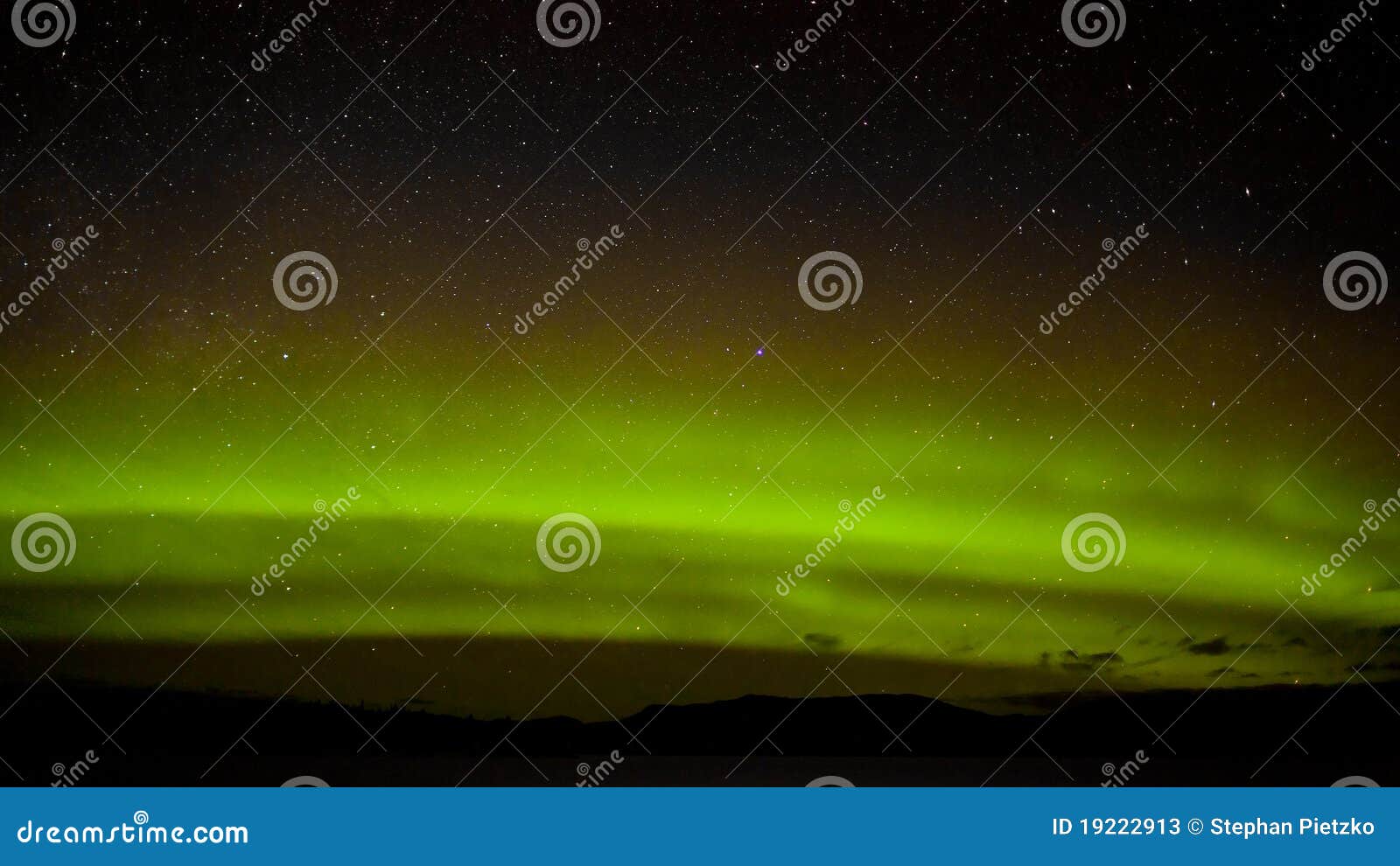 green northern lights and myriad of stars