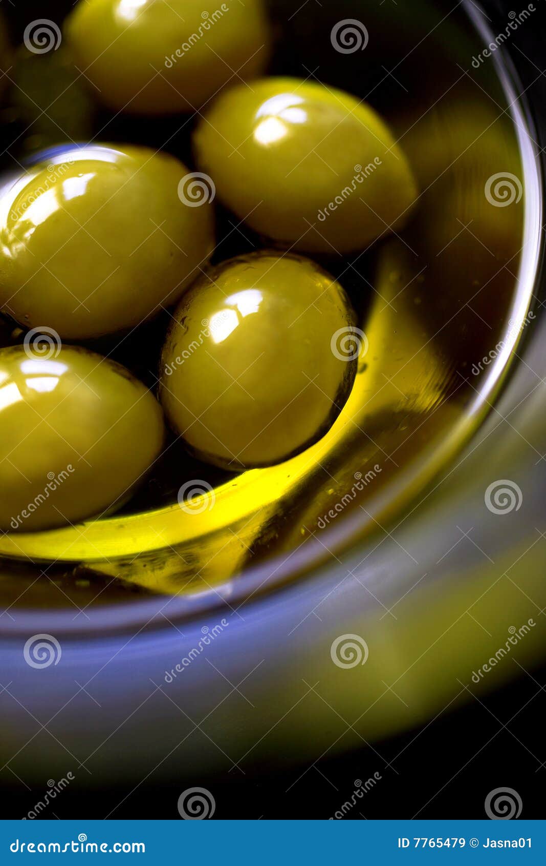 Green olives in olive oil stock image. Image of taste 7765479
