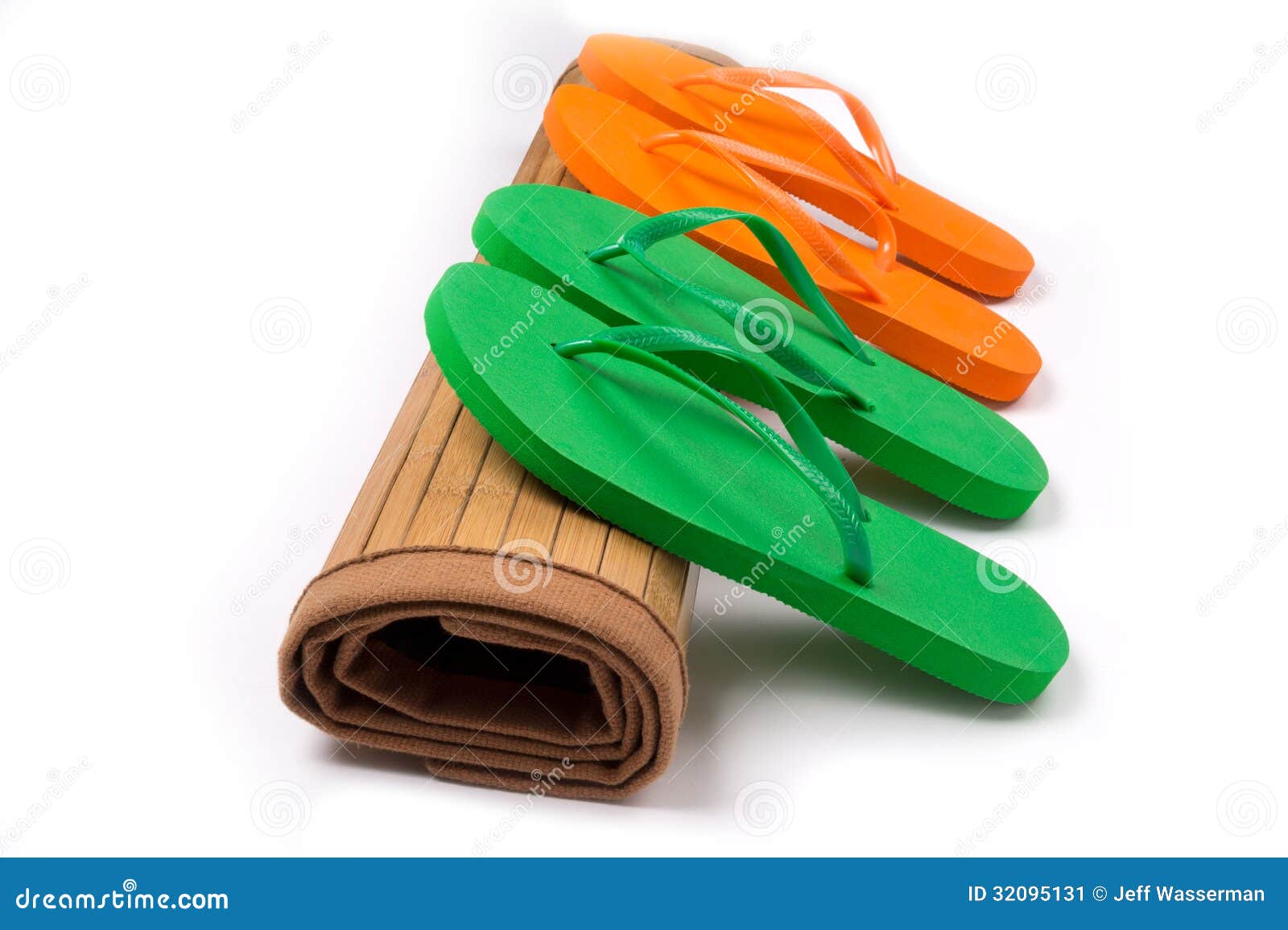 Green and Orange Flip Flops on Rolled Bamboo Mat Stock Image - Image of ...