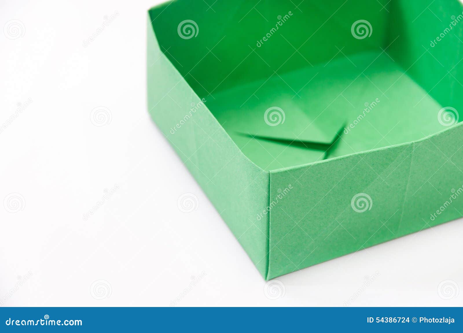 Green origami box on the white background.