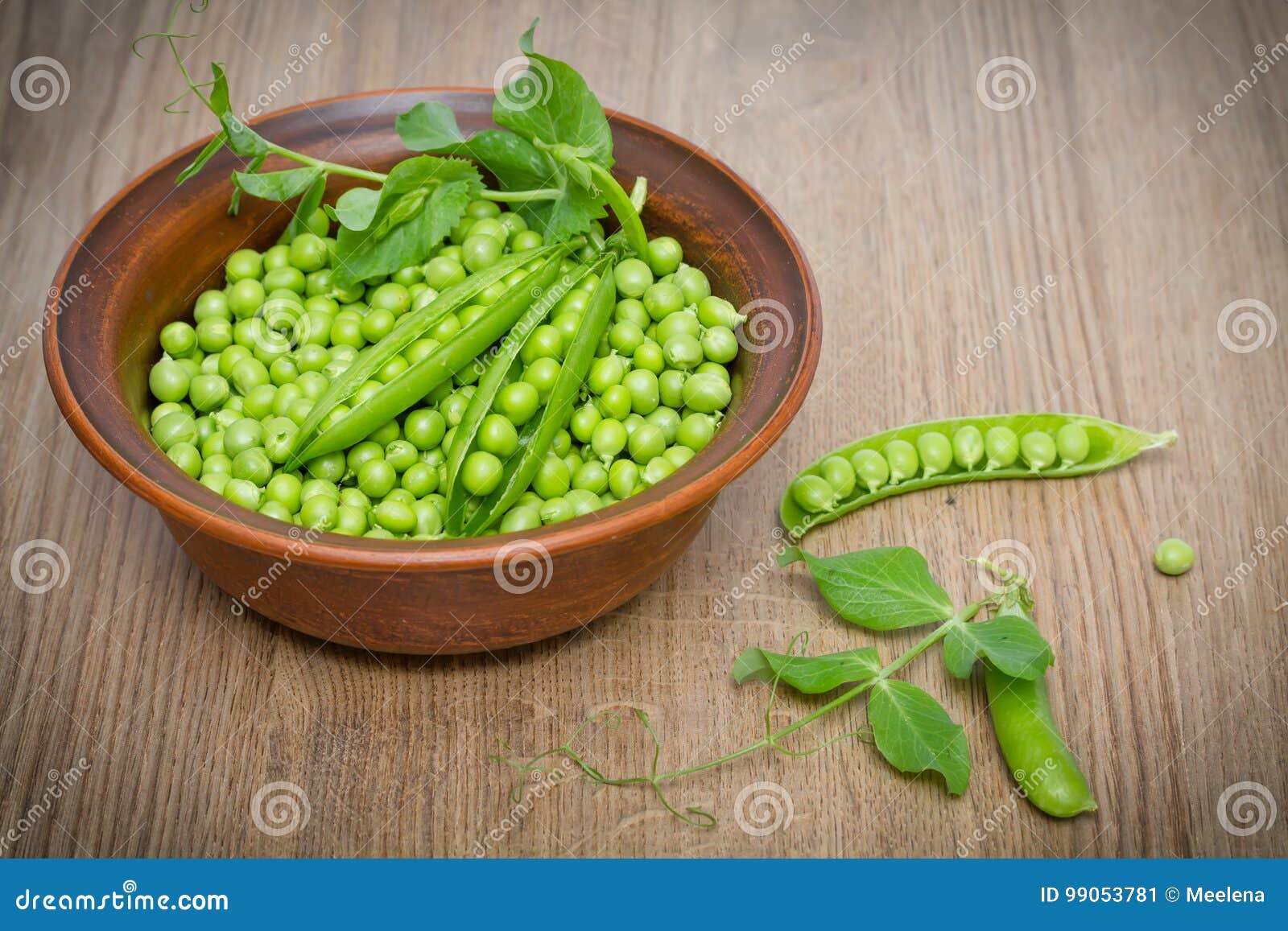 Green Peas in a Clay Bowl on a Wooden Table Stock Image - Image of