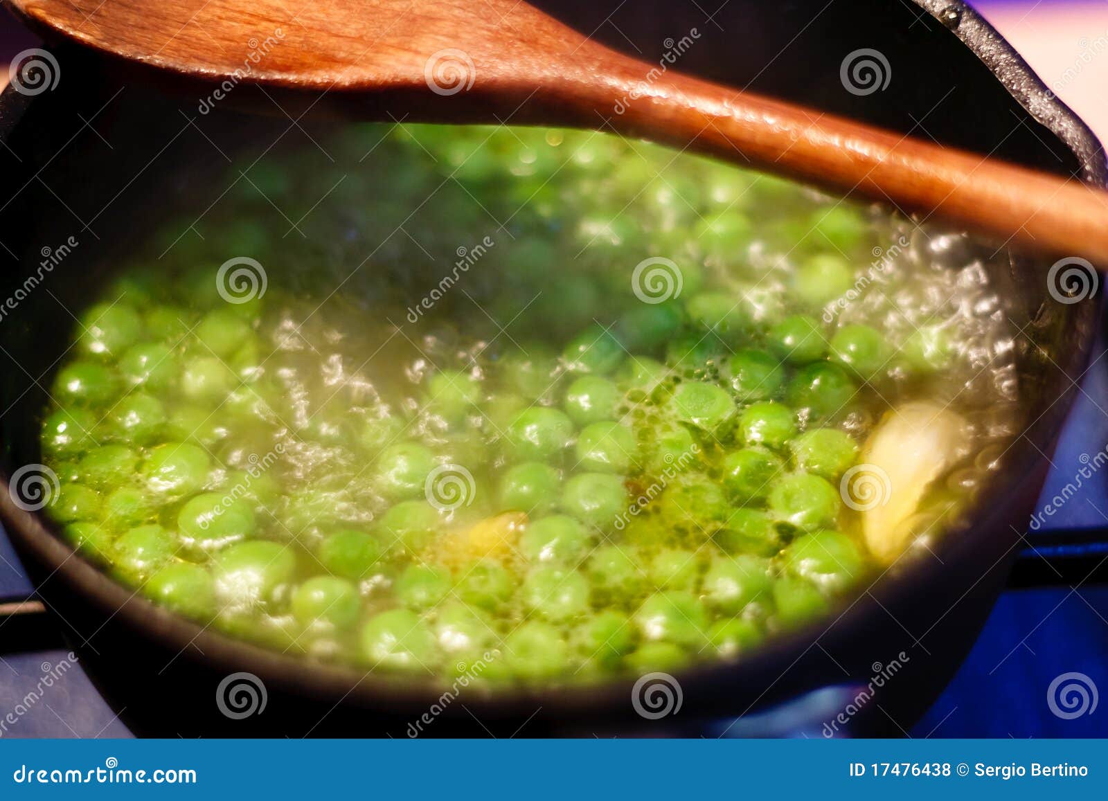 Green peas cooking in pan stock photo. Image of cooks 17476438
