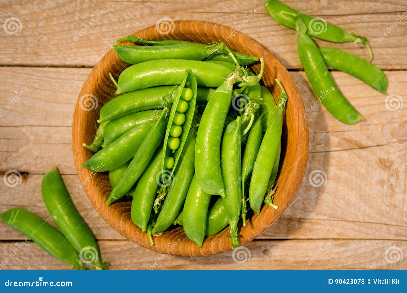 Download Green Peas In Wooden Bowl On Wooden Background. Stock ...