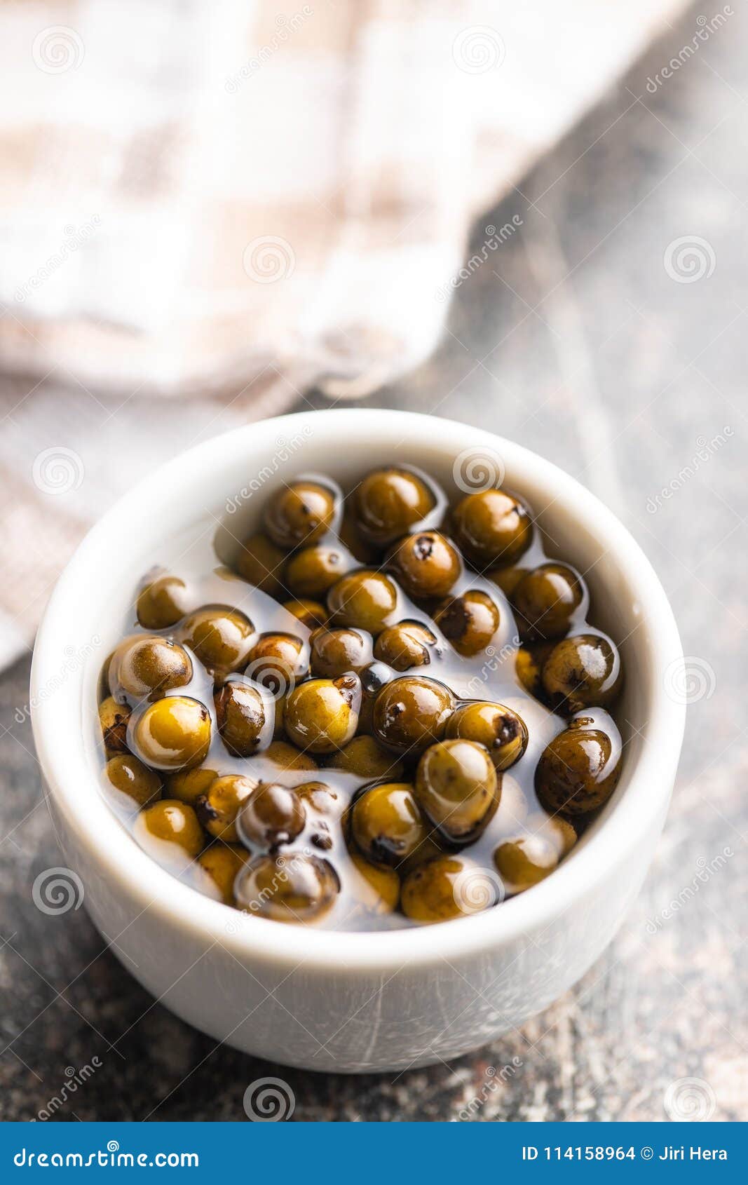 Green peppercorn in brine. stock photo. Image of seasoning 114158964