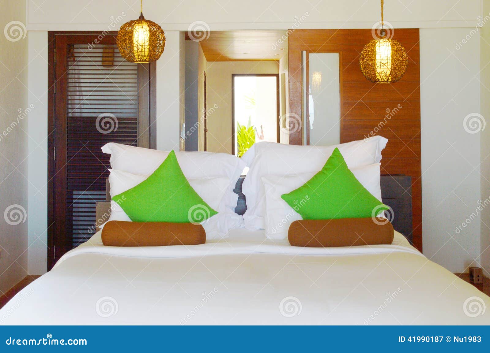 Green pillows in bedroom stock image. Image of space 41990187