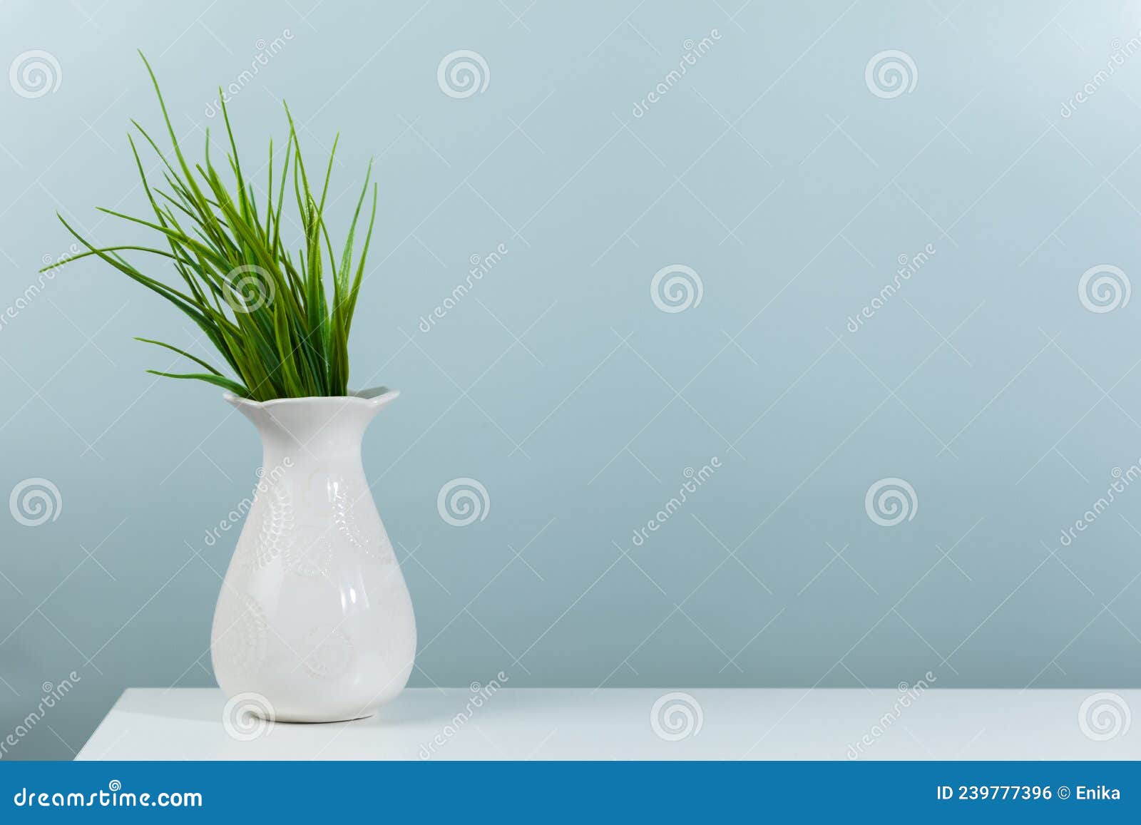 Green Plant in a White Vase on a Green Background Stock Photo - Image ...