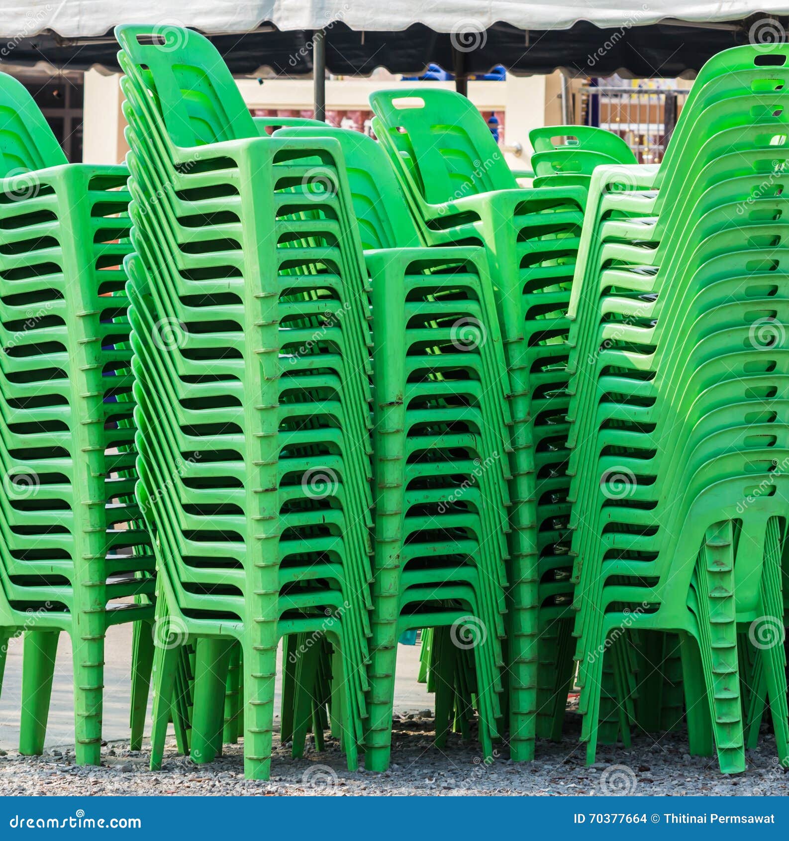 Green plastic chairs stock photo. Image of furniture 70377664