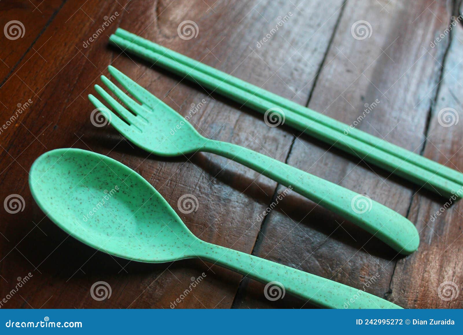 Green plastic tableware stock photo. Image of plastic 242995272