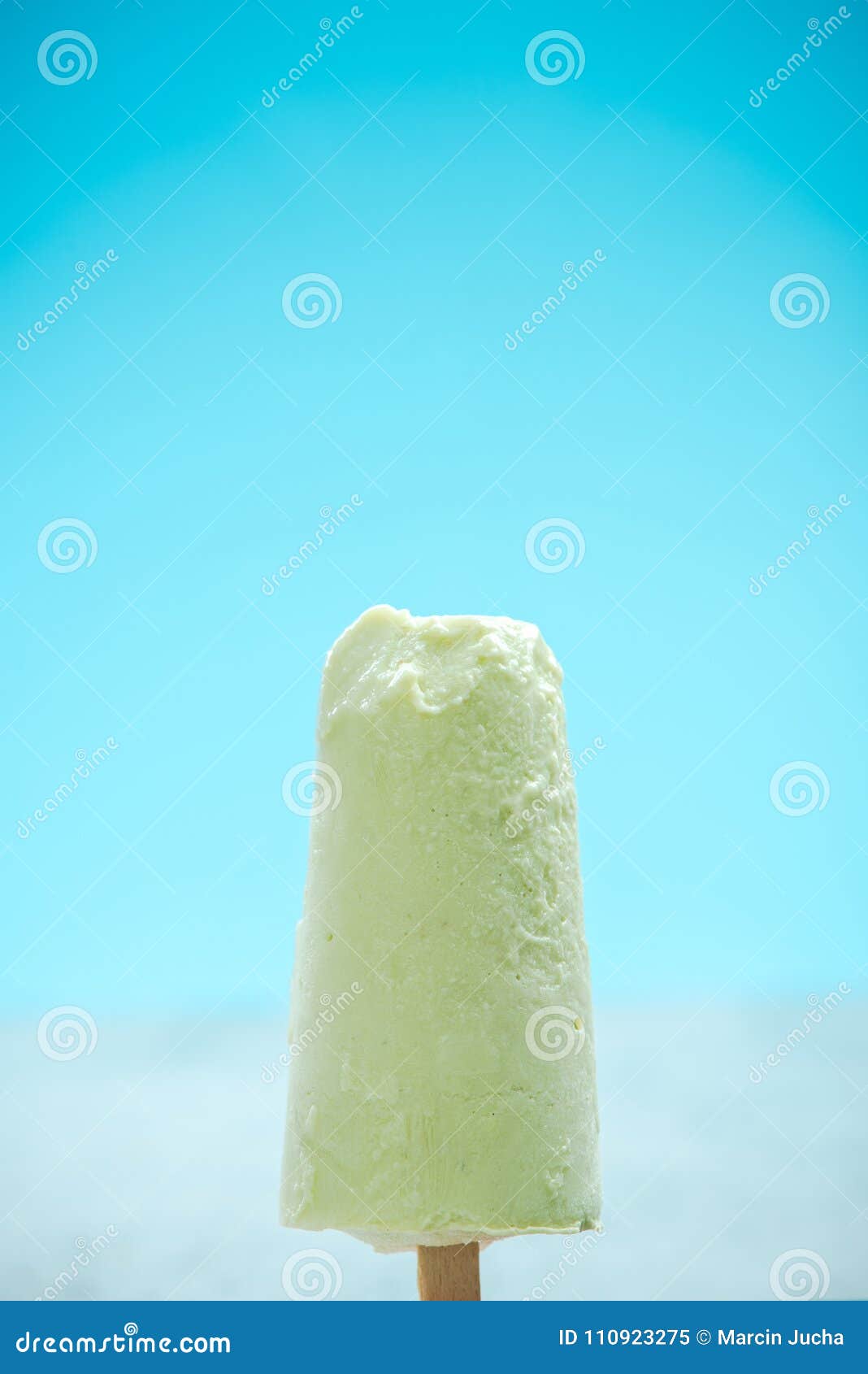 Green Popsicle Over Blue Background Stock Image Image of natural, snack 110923275