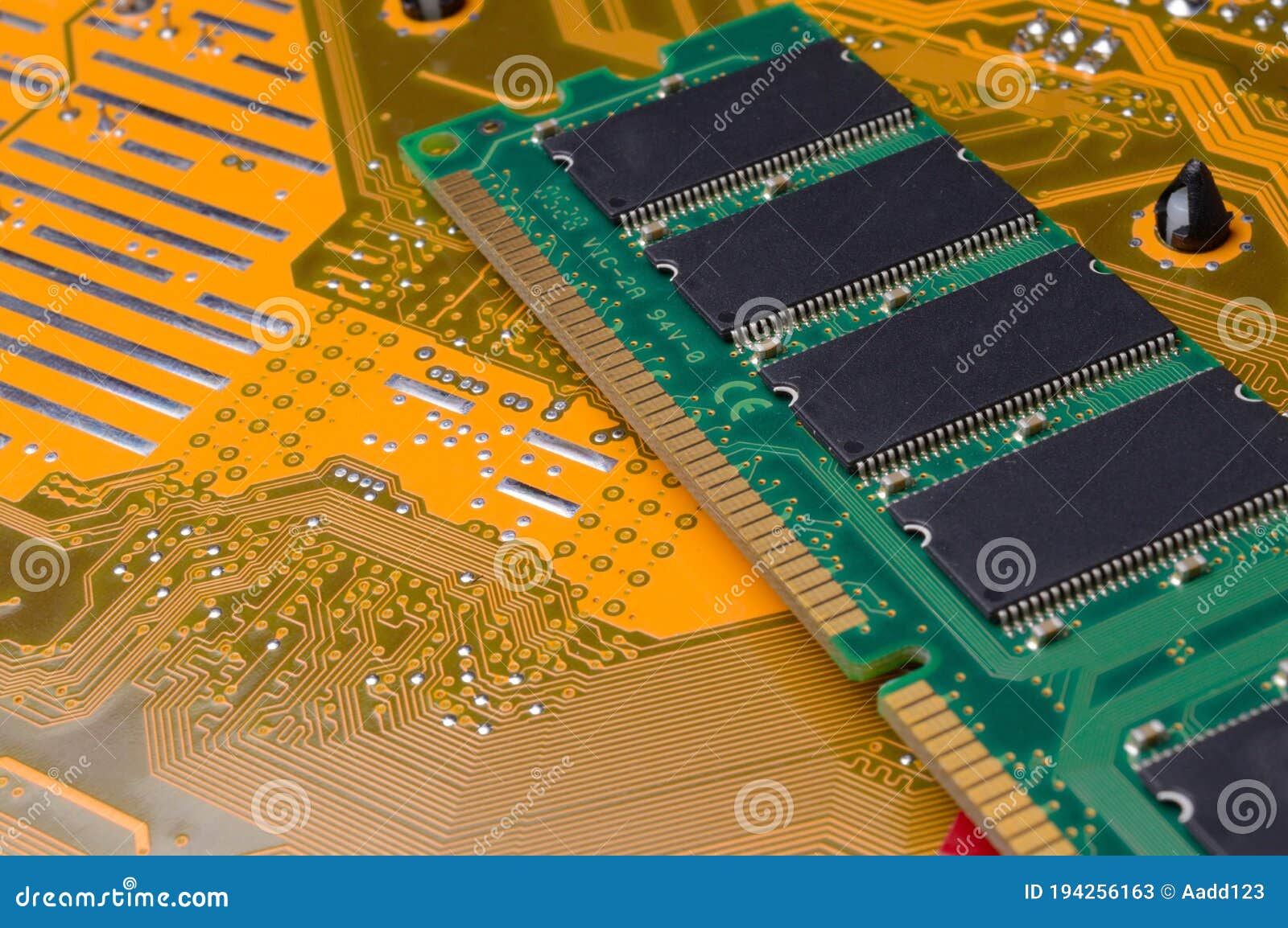 The Green RAM Bar is on the Yellow Motherboard. Stock Image Image of