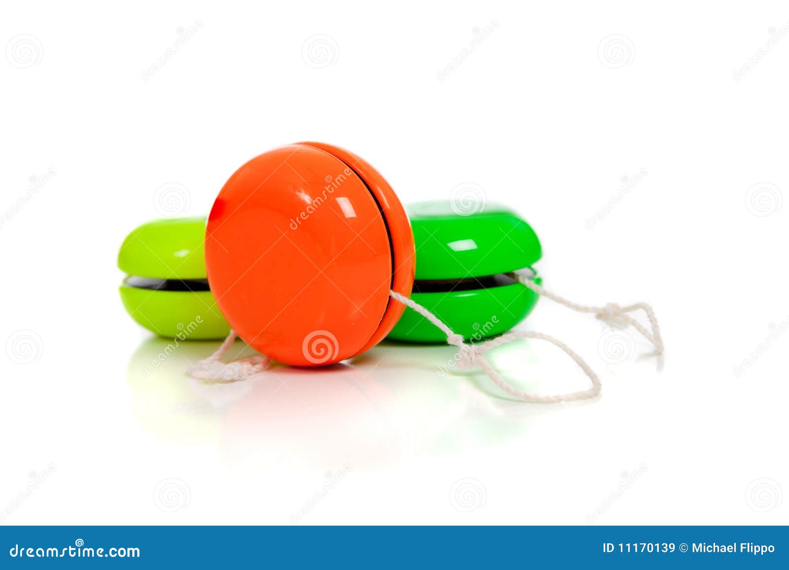 Green and Red Yoyos on a White Background Stock Image Image of yoyo